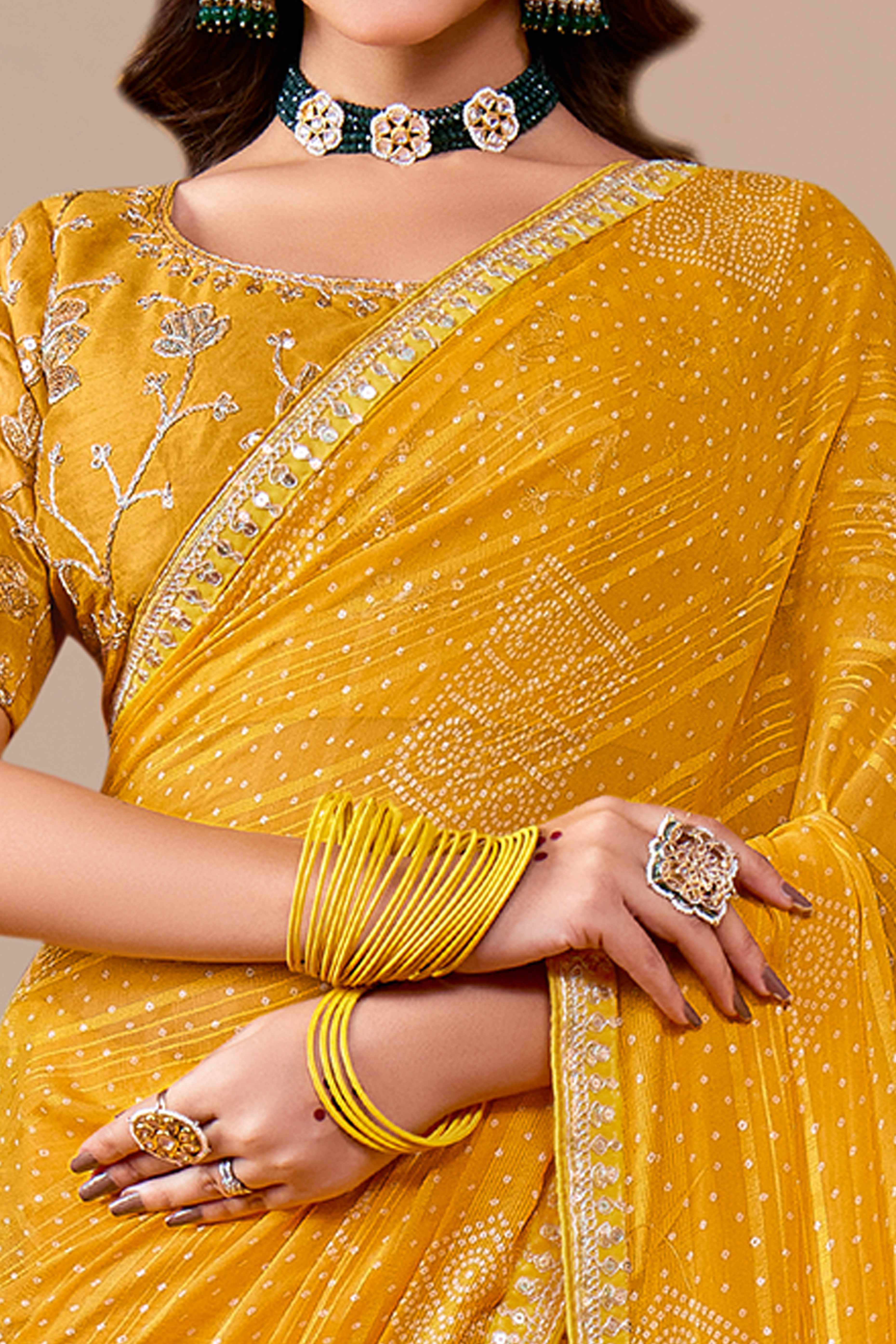 Mustard Bandhani Printed Georgette Saree Enhanced With Sequins & Cording Embroidered Lace Border