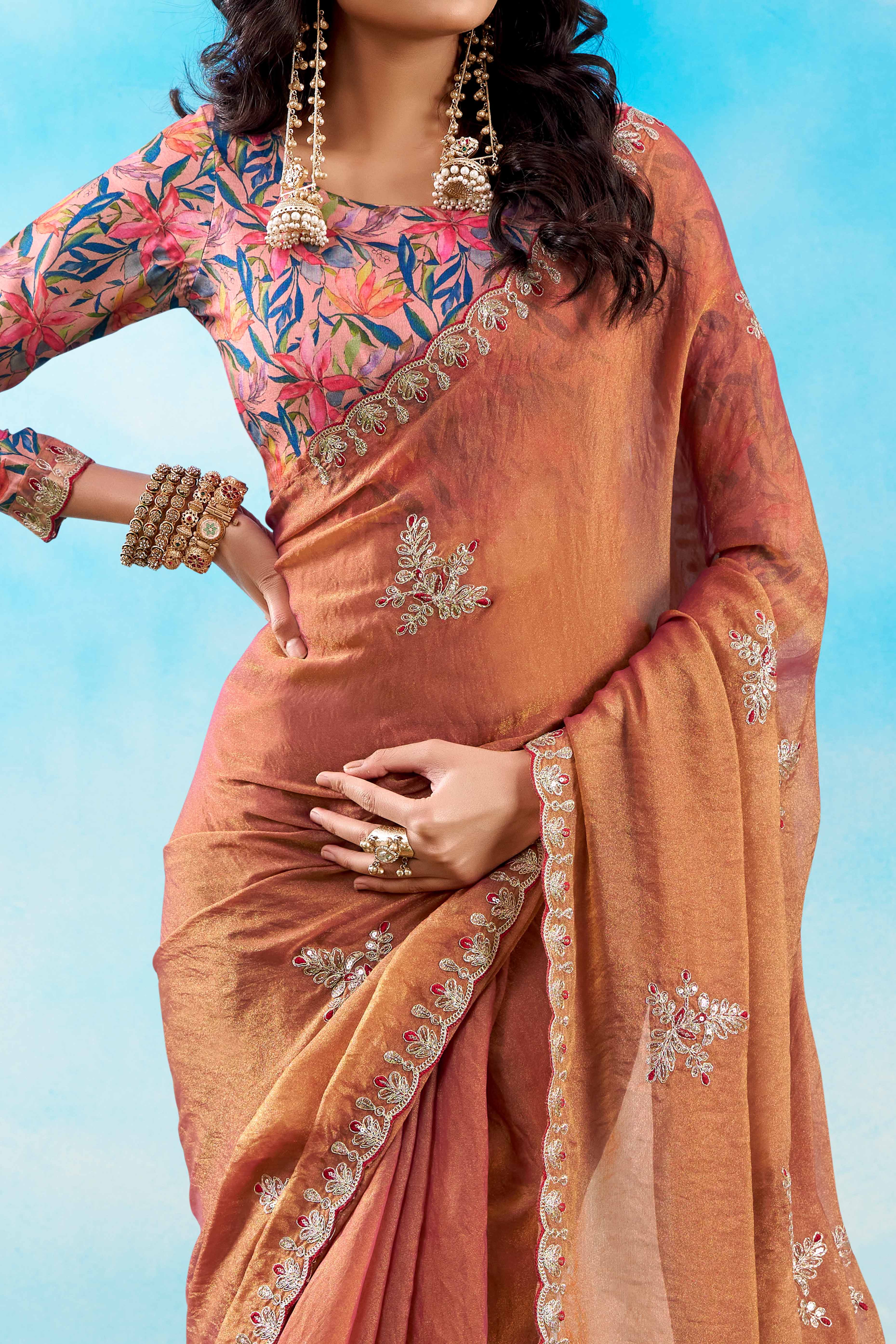 Luxurious Peach Chiffon Saree Showcasing Floral Sequins Embroidery In A Two Tone Finish
