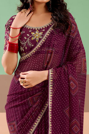 Charming Wine Bandhani Printed Georgette Saree Adorned With Intricate Cording Embroidered Border