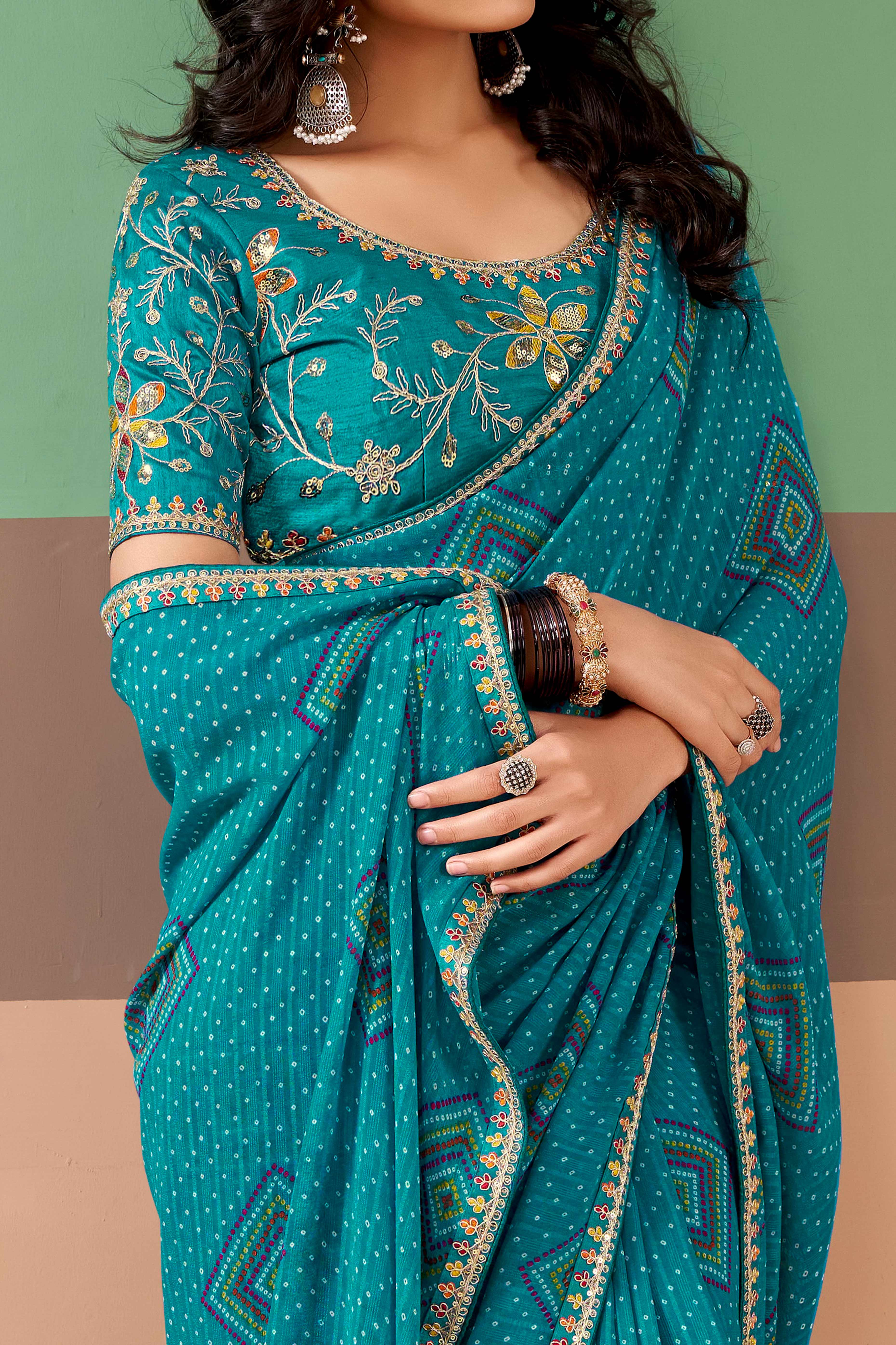 Charming Blue Bandhani Printed Georgette Saree Adorned With Intricate Cording Embroidered Border