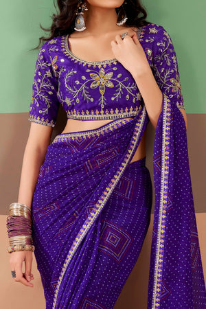 Charming Purple Bandhani Printed Georgette Saree Adorned With Intricate Cording Embroidered Border