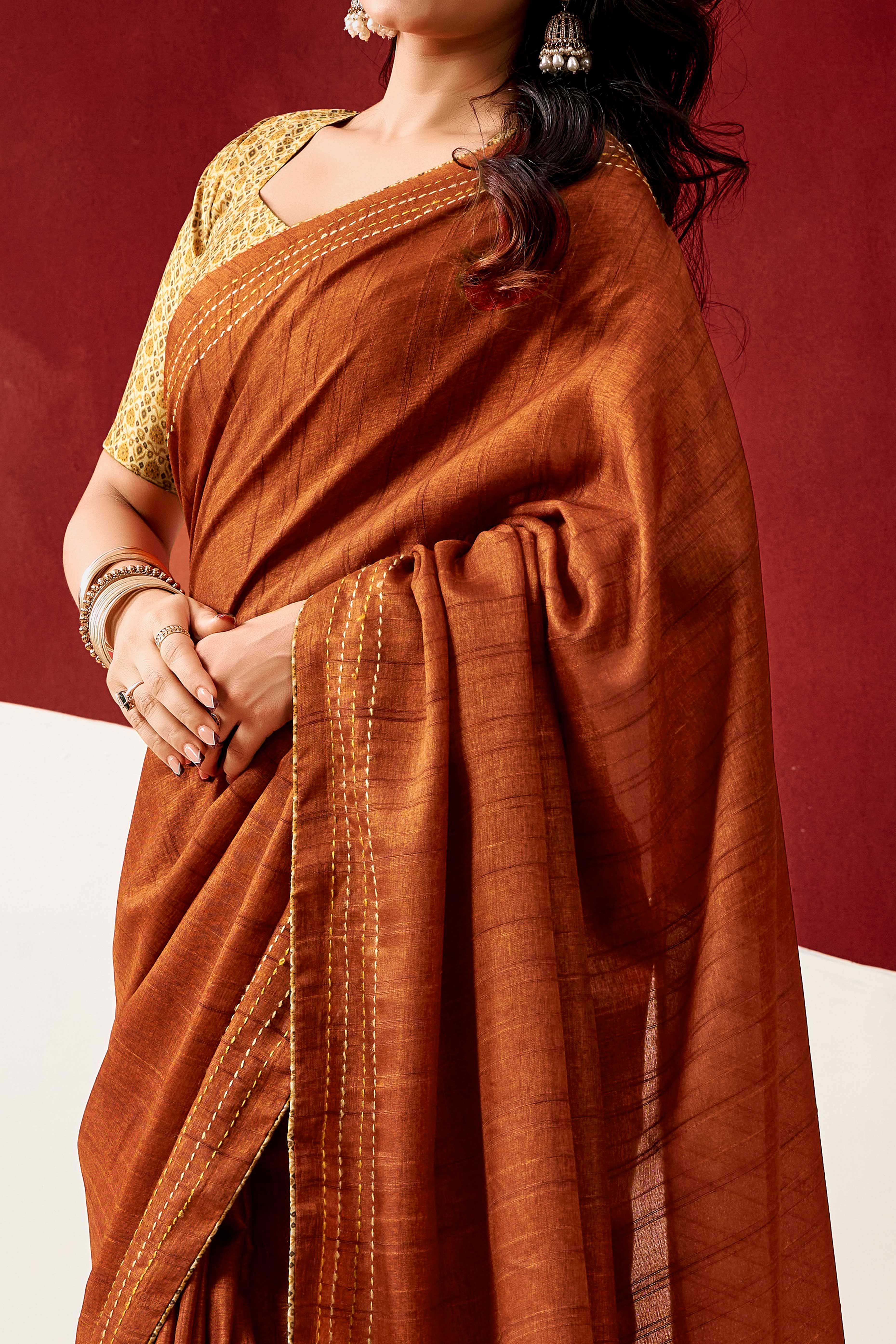 Graceful Rust Handloom Cotton Blend Saree Featuring Striped Lining Embroidery & Tassel Pallu