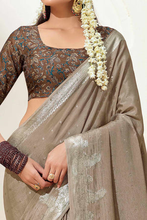 Beige Chinon Saree with Jacquard Weaving and Delicate Tassel Accents