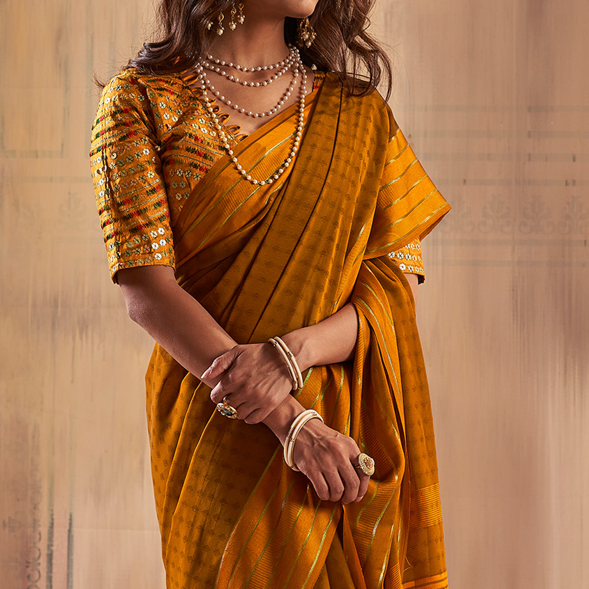 Mustard Woven Georgette Saree With Tassels