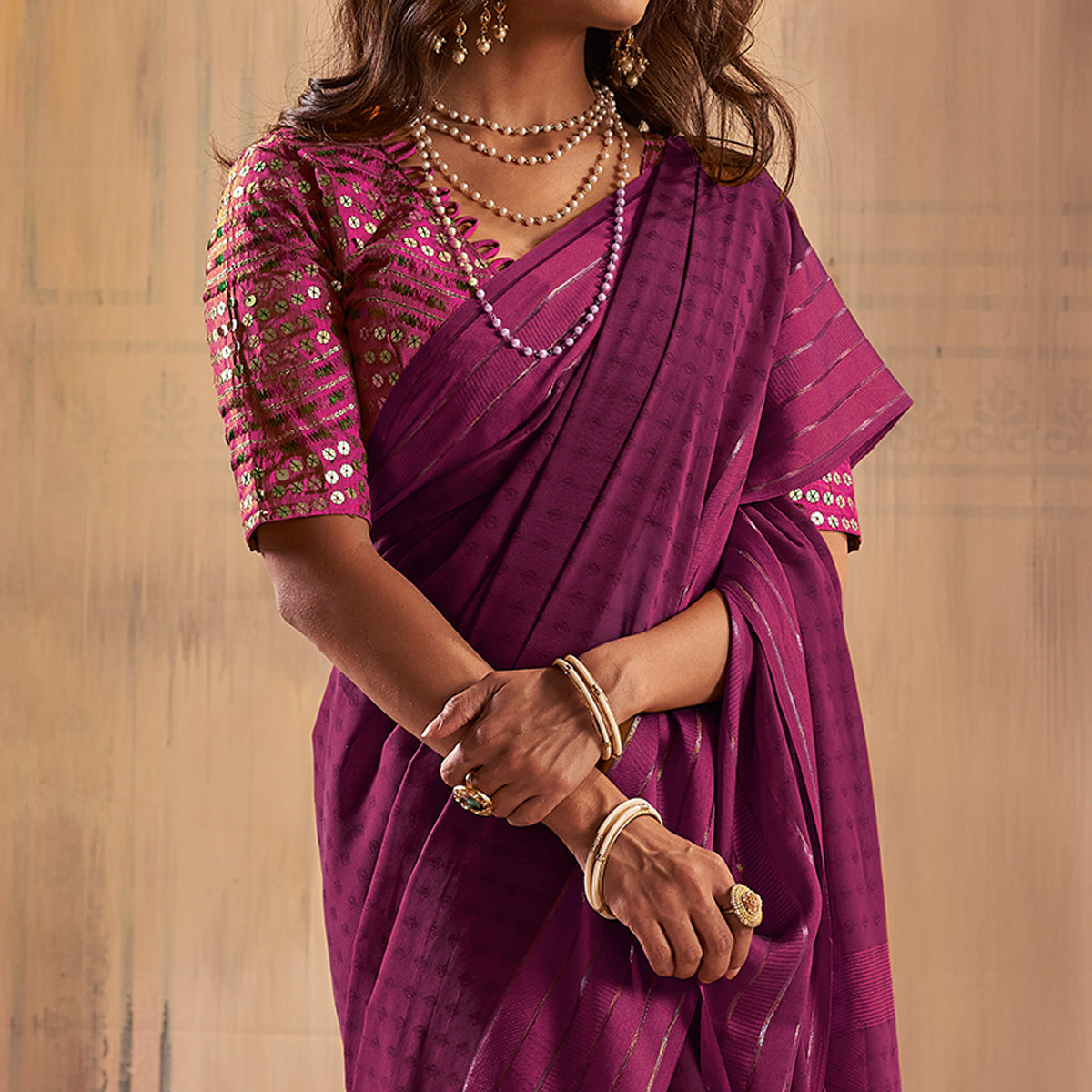 Purple Woven Georgette Saree With Tassels
