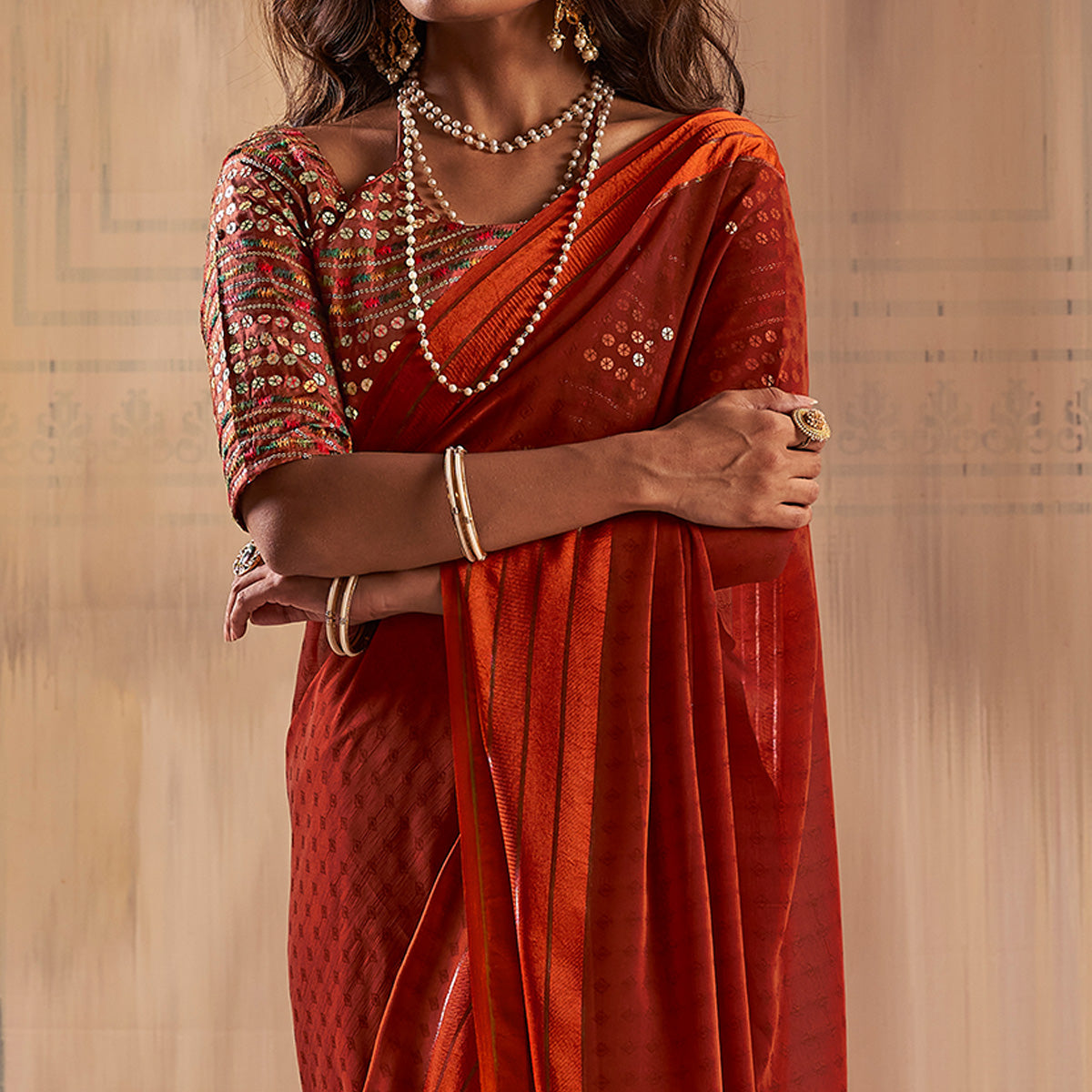 Rust Woven Georgette Saree With Tassels