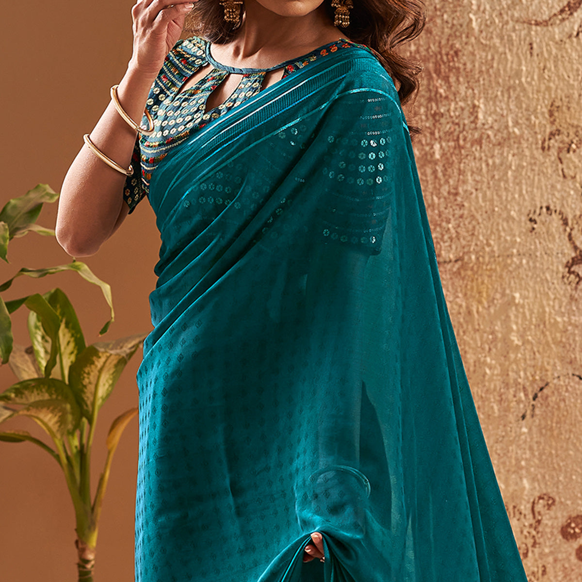 Teal Woven Georgette Saree With Tassels