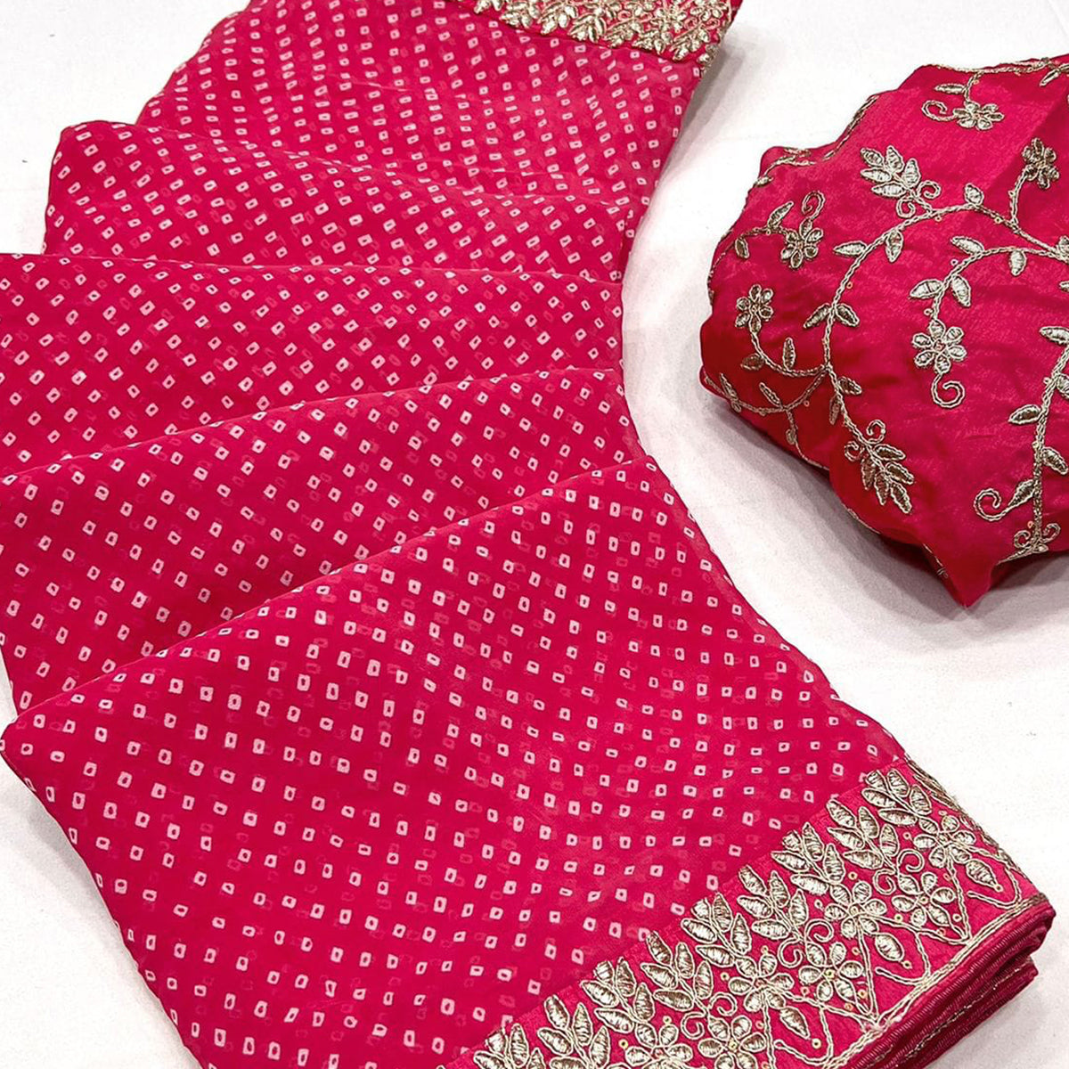 Pink Lightweight Georgette Saree Adorned with Classic Bandhani Prints and Lace Work