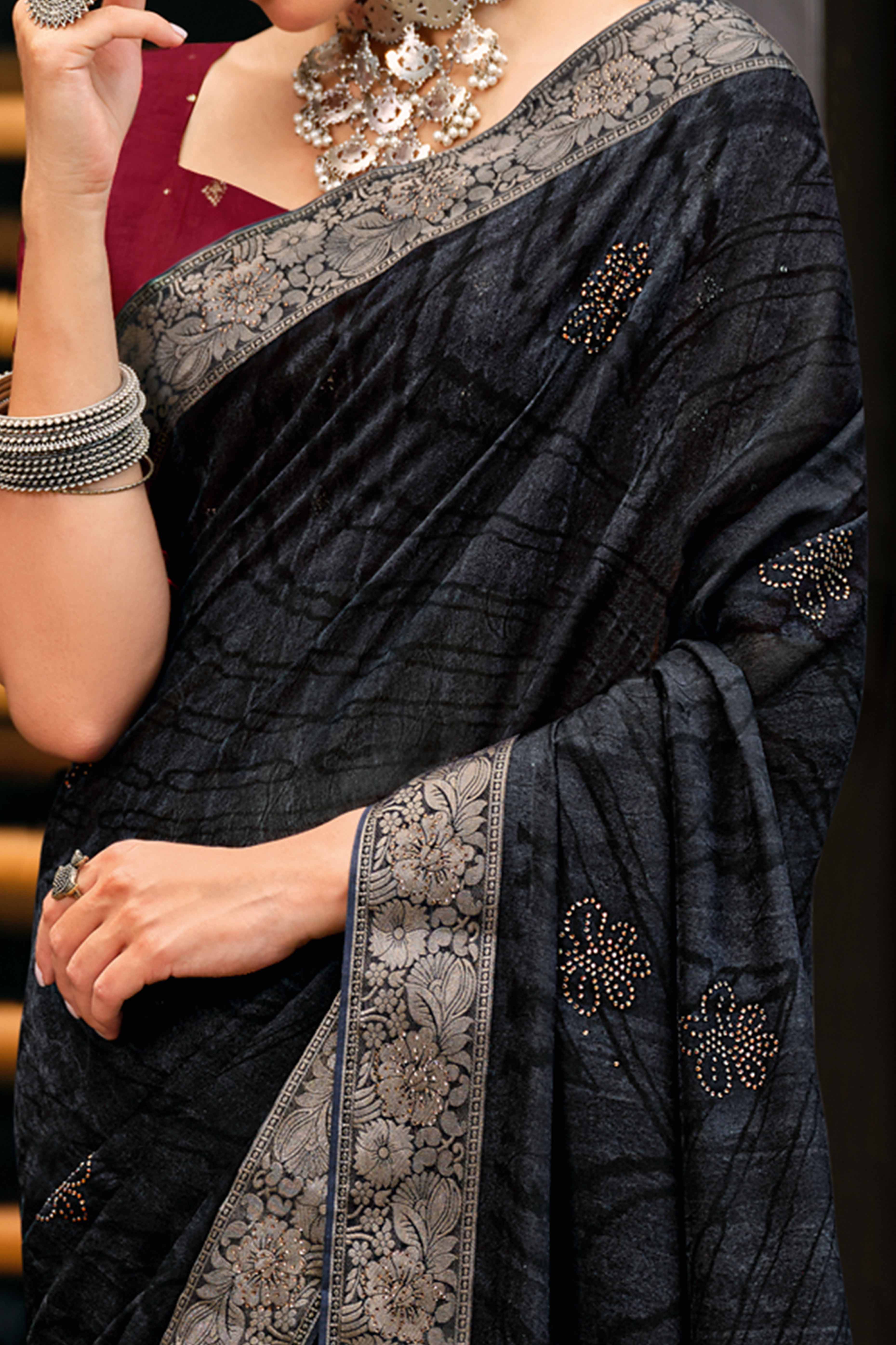 Black Abstract Printed Georgette Saree Enhanced with Subtle and Shiny Stone Work