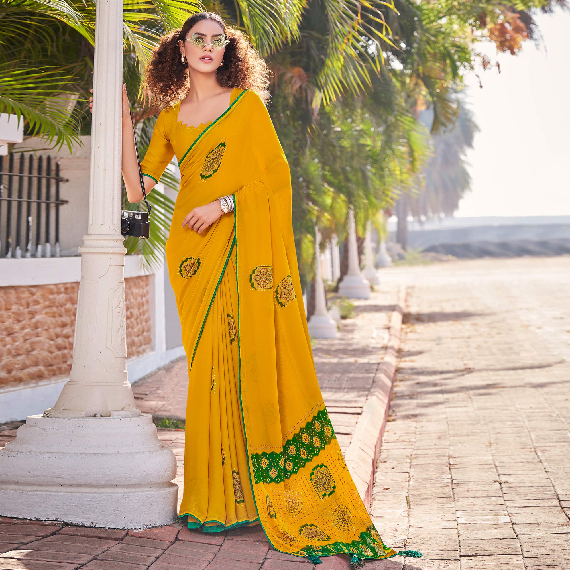 Mustard Foil Printed Georgette Saree With Tassels