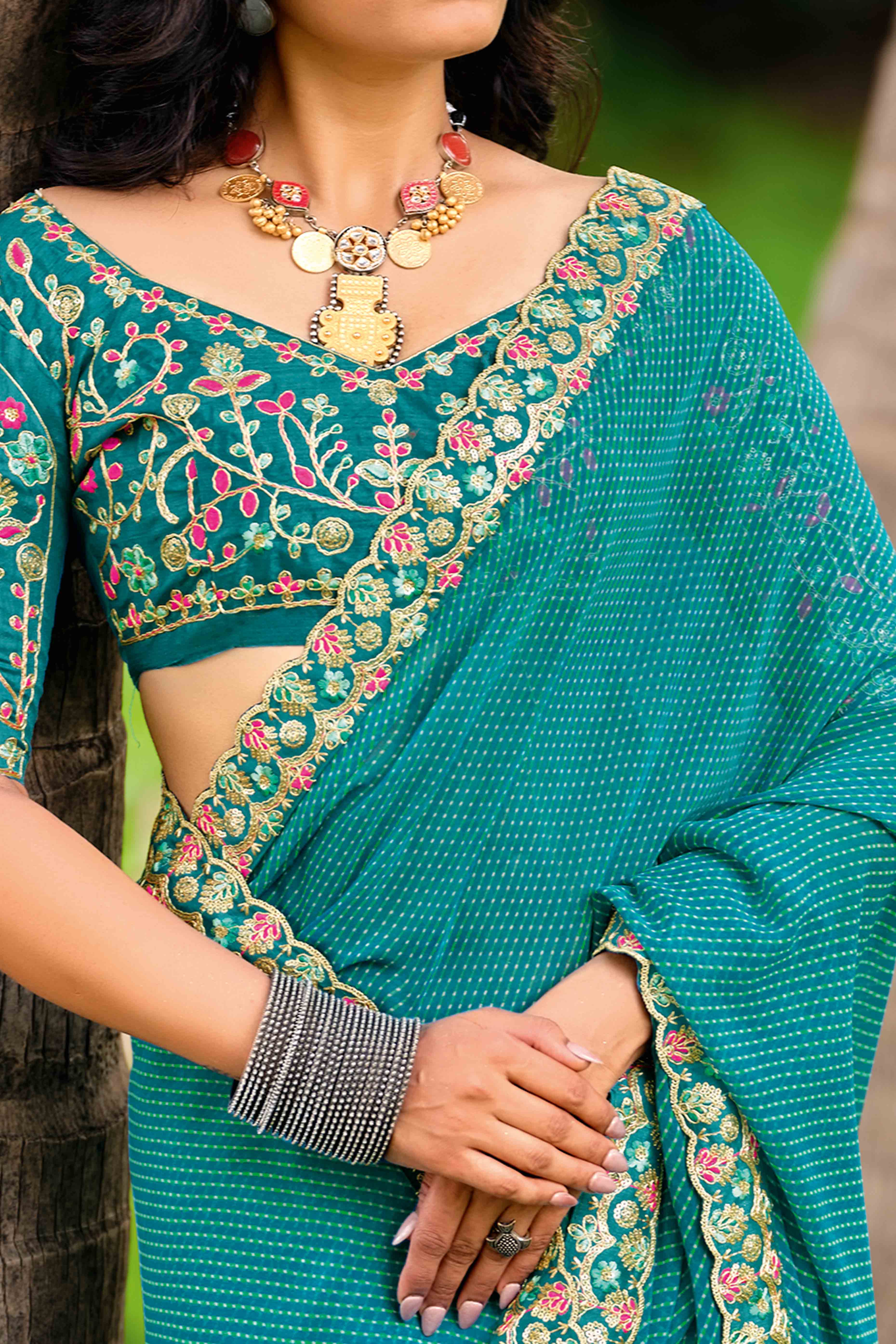 Rama Blue Striped Printed Georgette Saree With Shimmering Sequin Embroidered Border