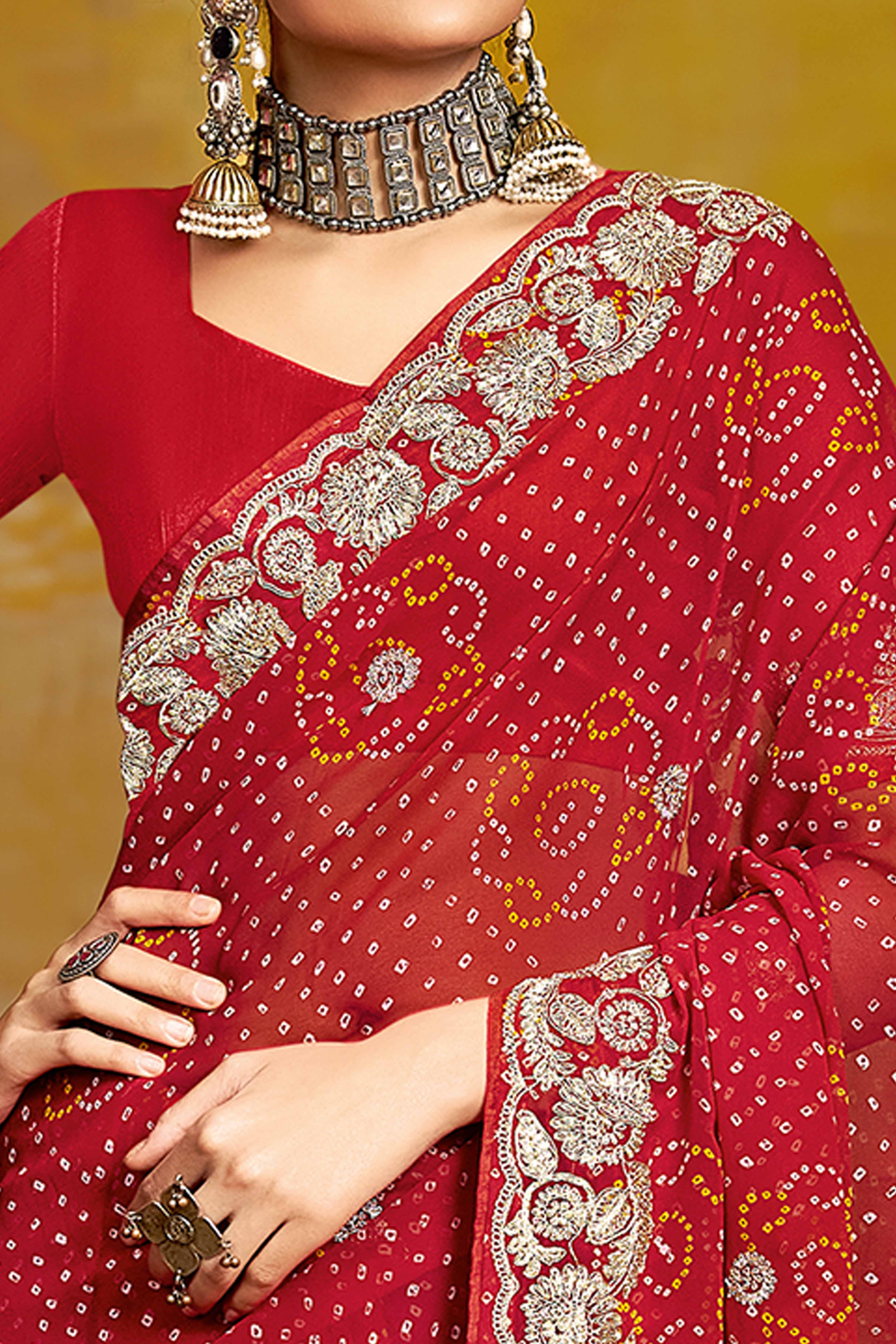 Maroon Georgette Saree Adorned With Traditional Bandhani Prints & Intricate Floral Embroidery