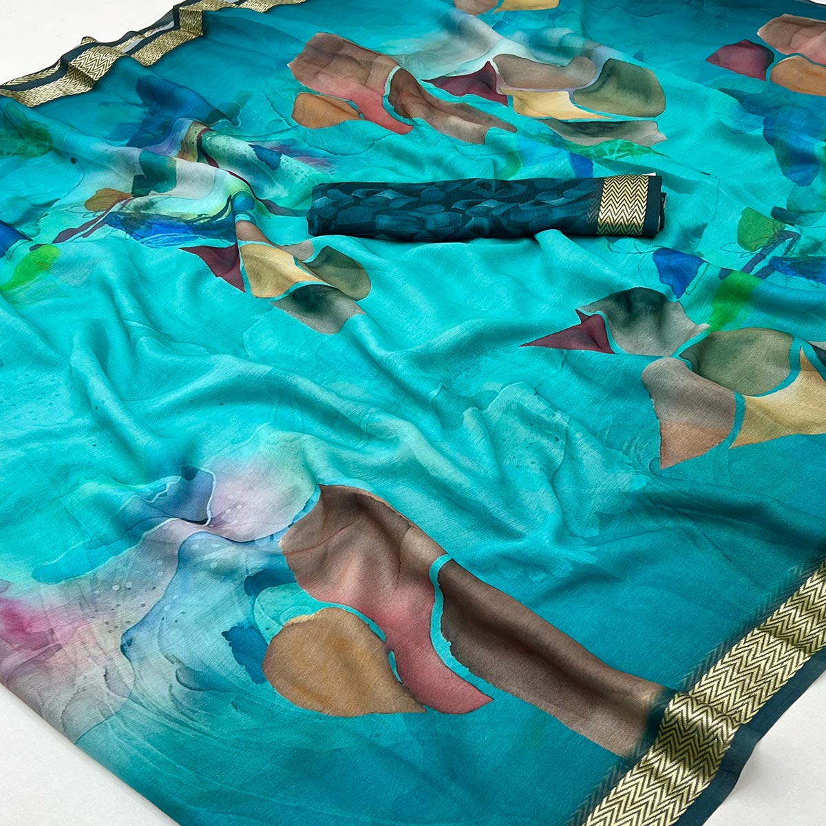 Graceful Turquoise Georgette Saree Accented With Digital Prints & Viscose Border Finish