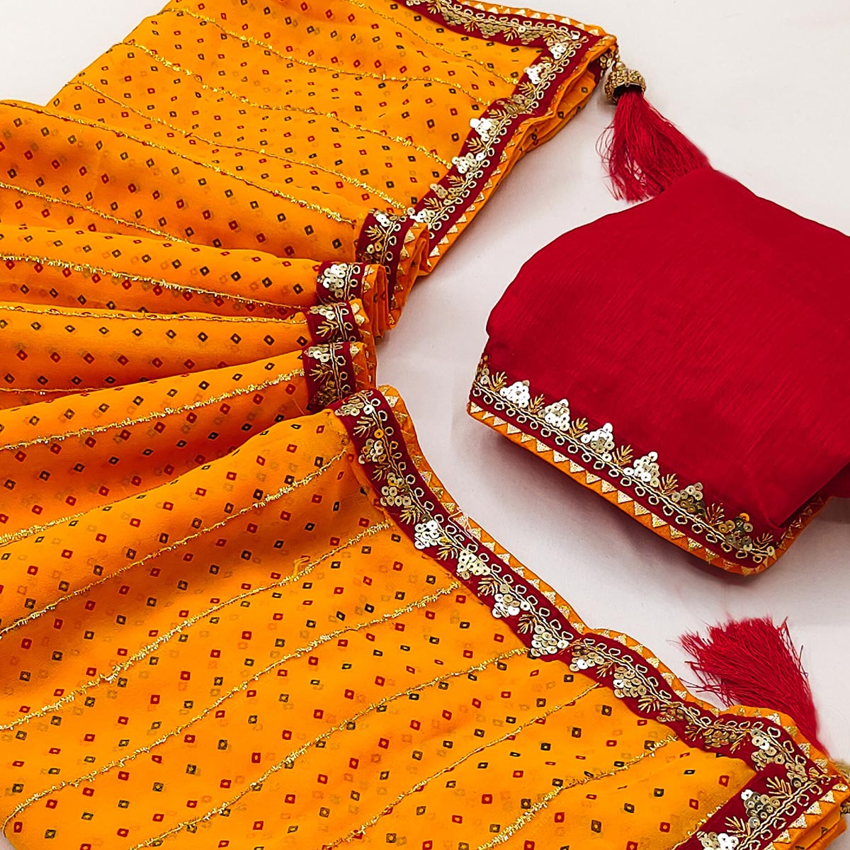 Charming Mustard Bandhani Printed Georgette Saree With Glittering Sequins & Zari Border