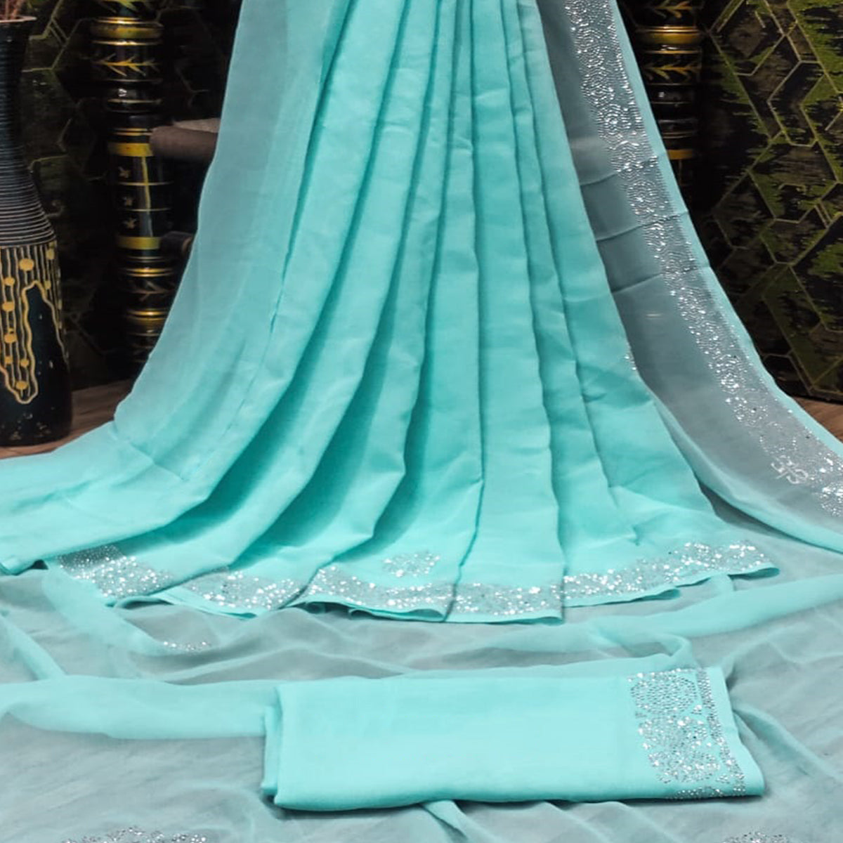 Turquoise Swarovski Work Georgette Saree With Tassels