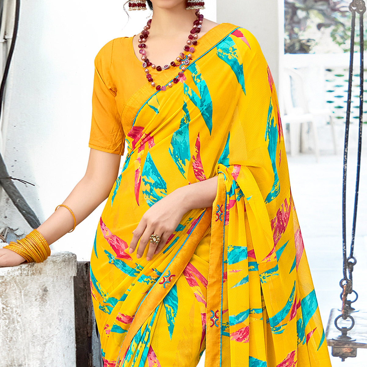 Yellow Geometric Printed Georgette Saree With Lace Border