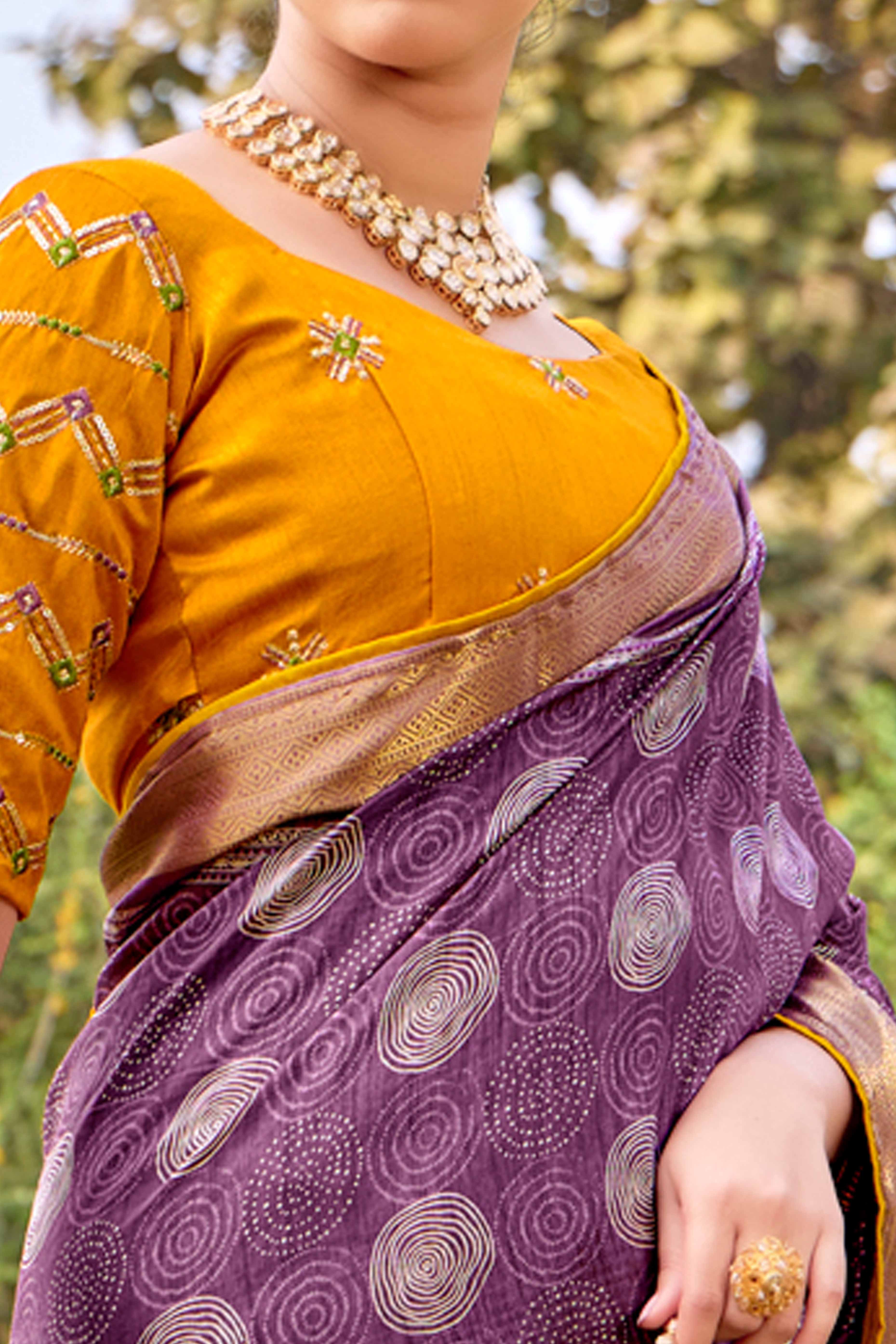 Purple Printed Dola Silk Saree With Ornate Zari Border & Tassel Pallu