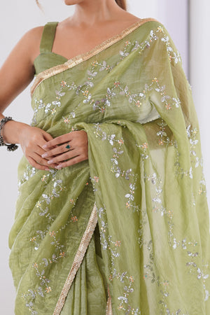 Dazzling Pista Green Organza Saree Accented with Sequin, Bead & Stone Work and Delicate Lace Detailing