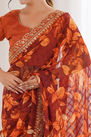 Elegant Rust Leaf & Floral Print Georgette Saree With Intricate Cording Sequins Embroidery Border