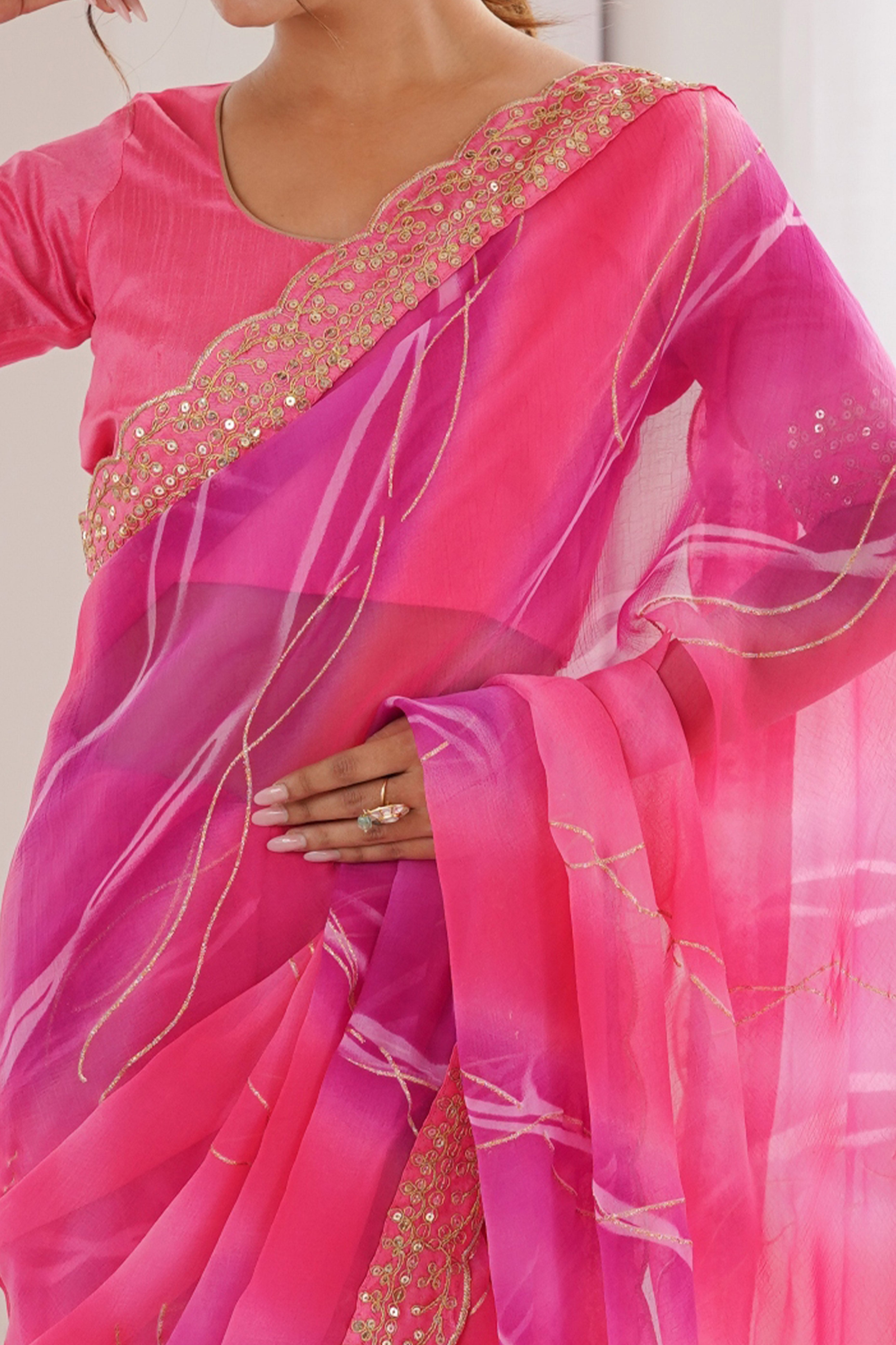 Graceful Pink Foil Print Georgette Saree Featuring A Luxurious Cording Sequins Embroidered Border