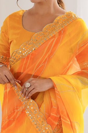 Graceful Yellow Foil Print Georgette Saree Featuring A Luxurious Cording Sequins Embroidered Border