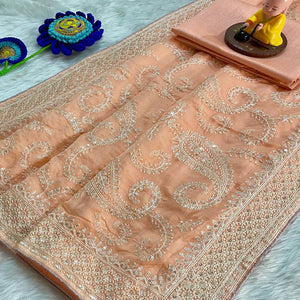 Lustrous Light Orange Organza Silk Saree Beautified With Paisley Embroidery & Glittering Sequins