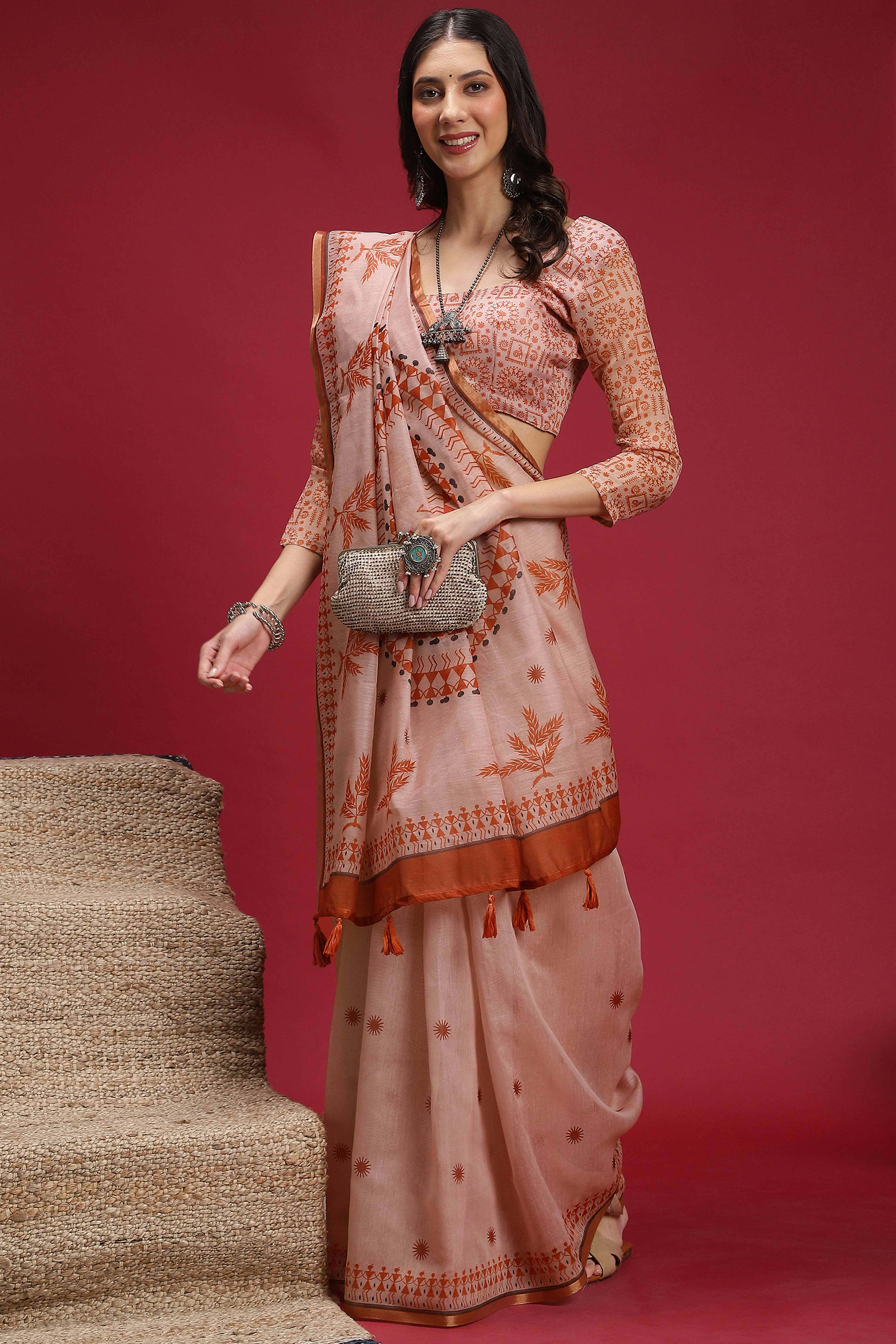 Light Peach Linen Cotton Saree Featuring Traditional Warli Prints & Tassel Pallu