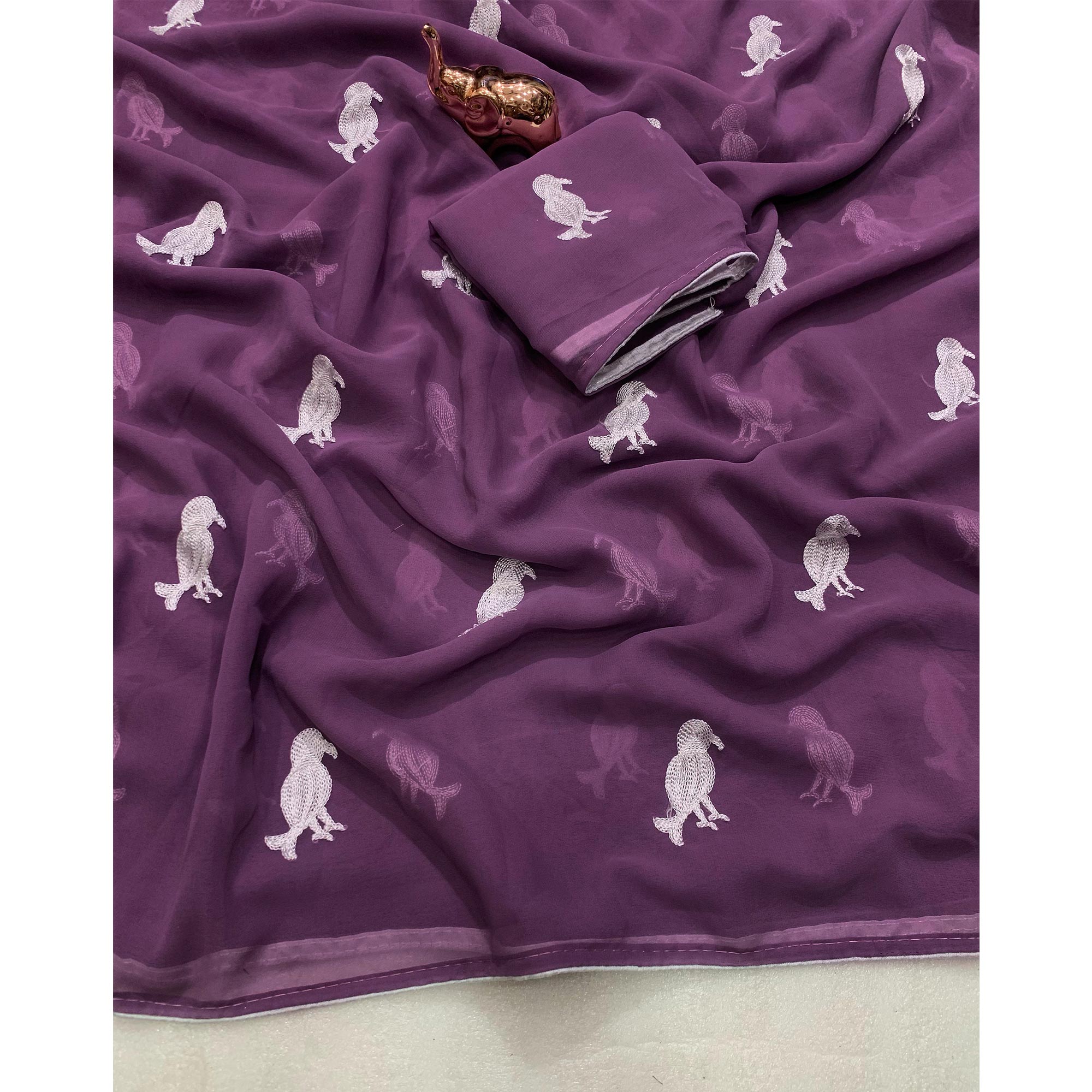 Light Purple Georgette Saree Adorned With Elegant Bird Embroidery