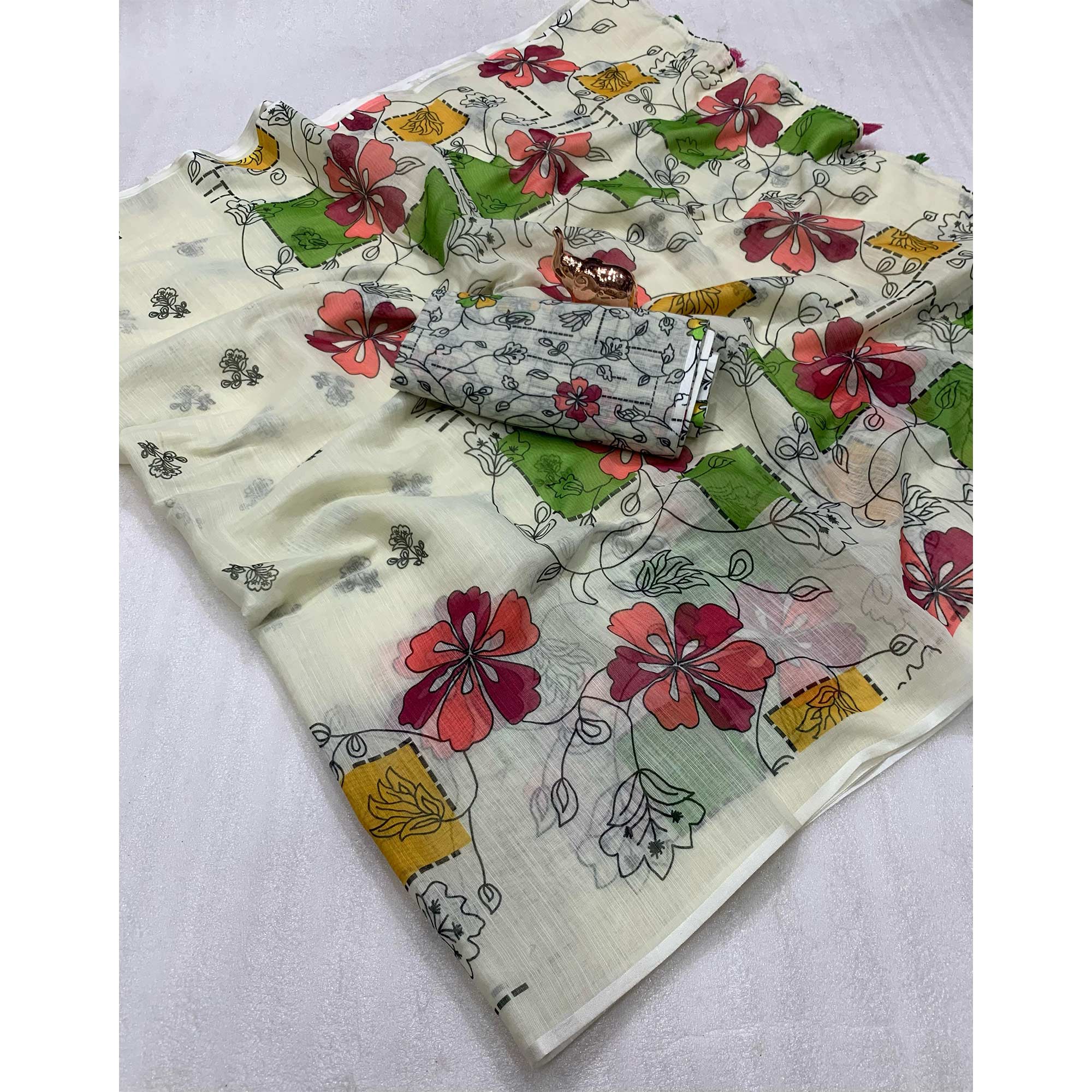 Light Cream Floral Printed Linen Saree With Elegant Tassel Border