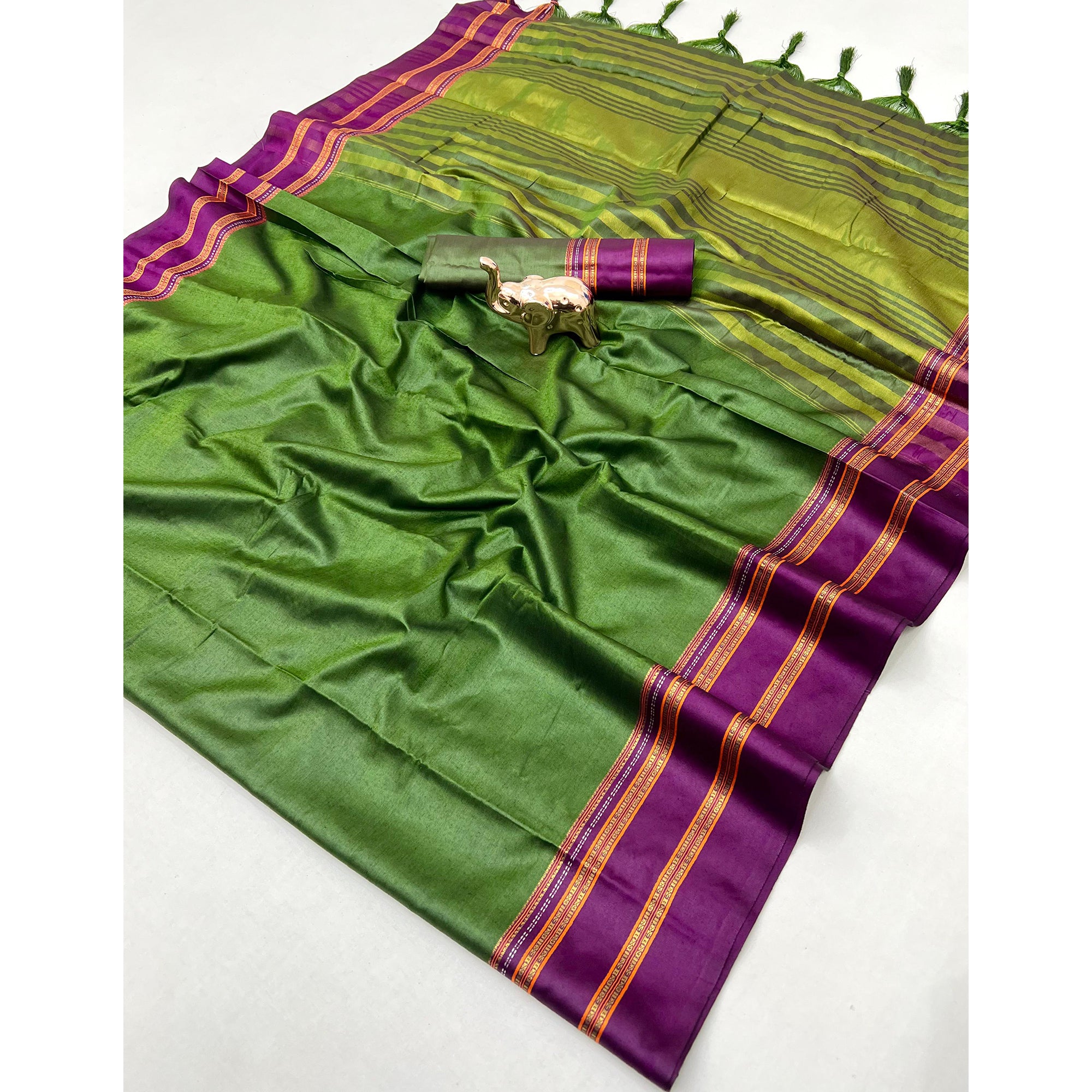Classic Green Solid Weaving Pure Silk Saree Accented With Woven Striped Pallu & Tassel Finish