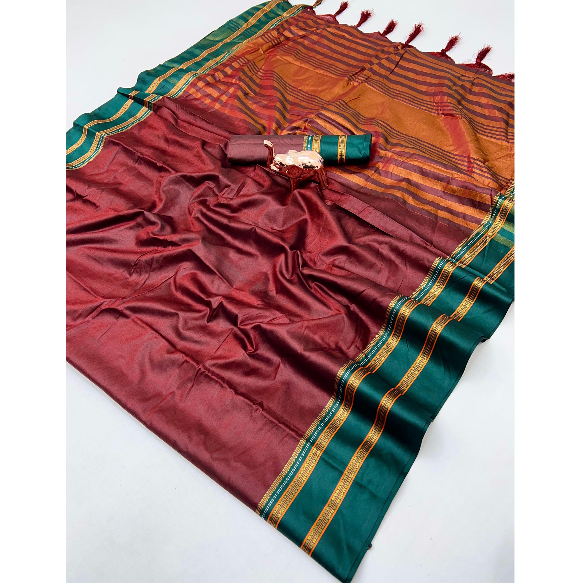 Classic Maroon Solid Weaving Pure Silk Saree Accented With Woven Striped Pallu & Tassel Finish