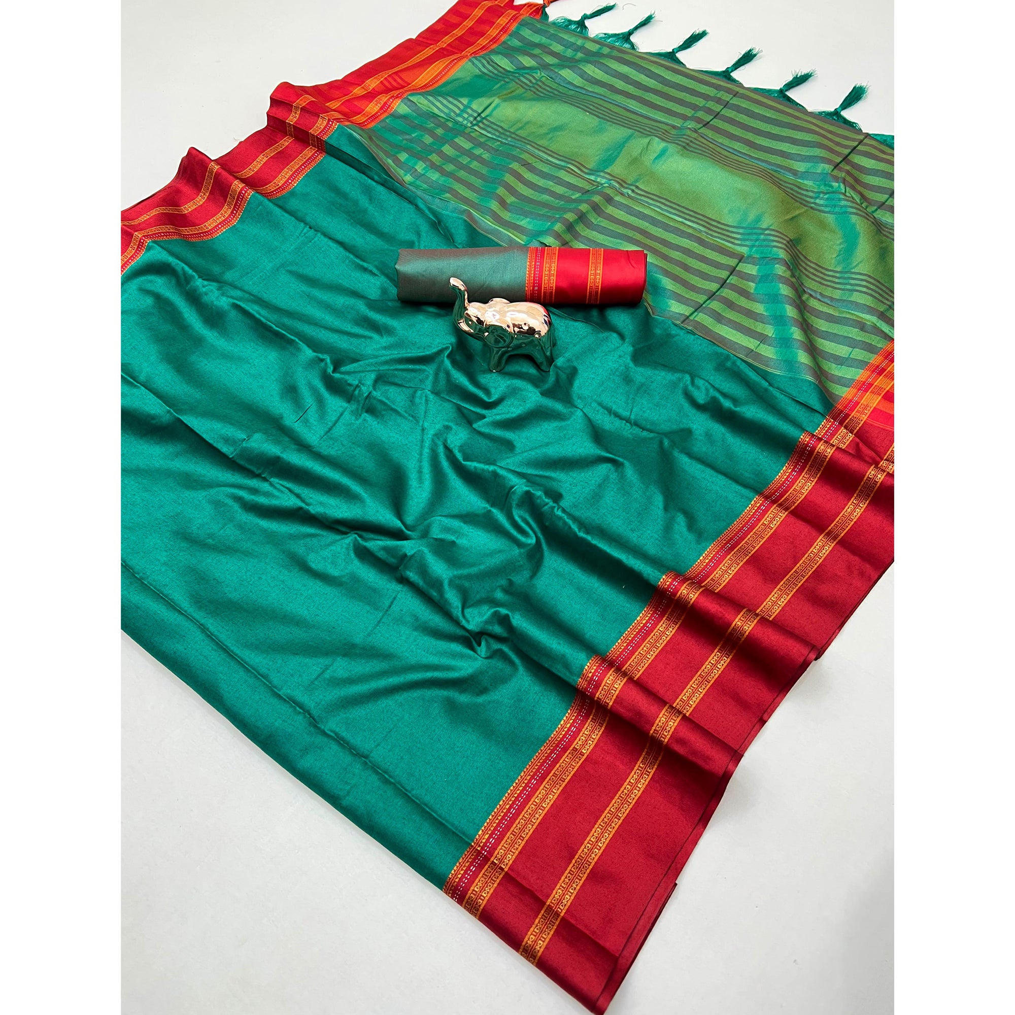 Classic Teal Green Solid Weaving Pure Silk Saree Accented With Woven Striped Pallu & Tassel Finish