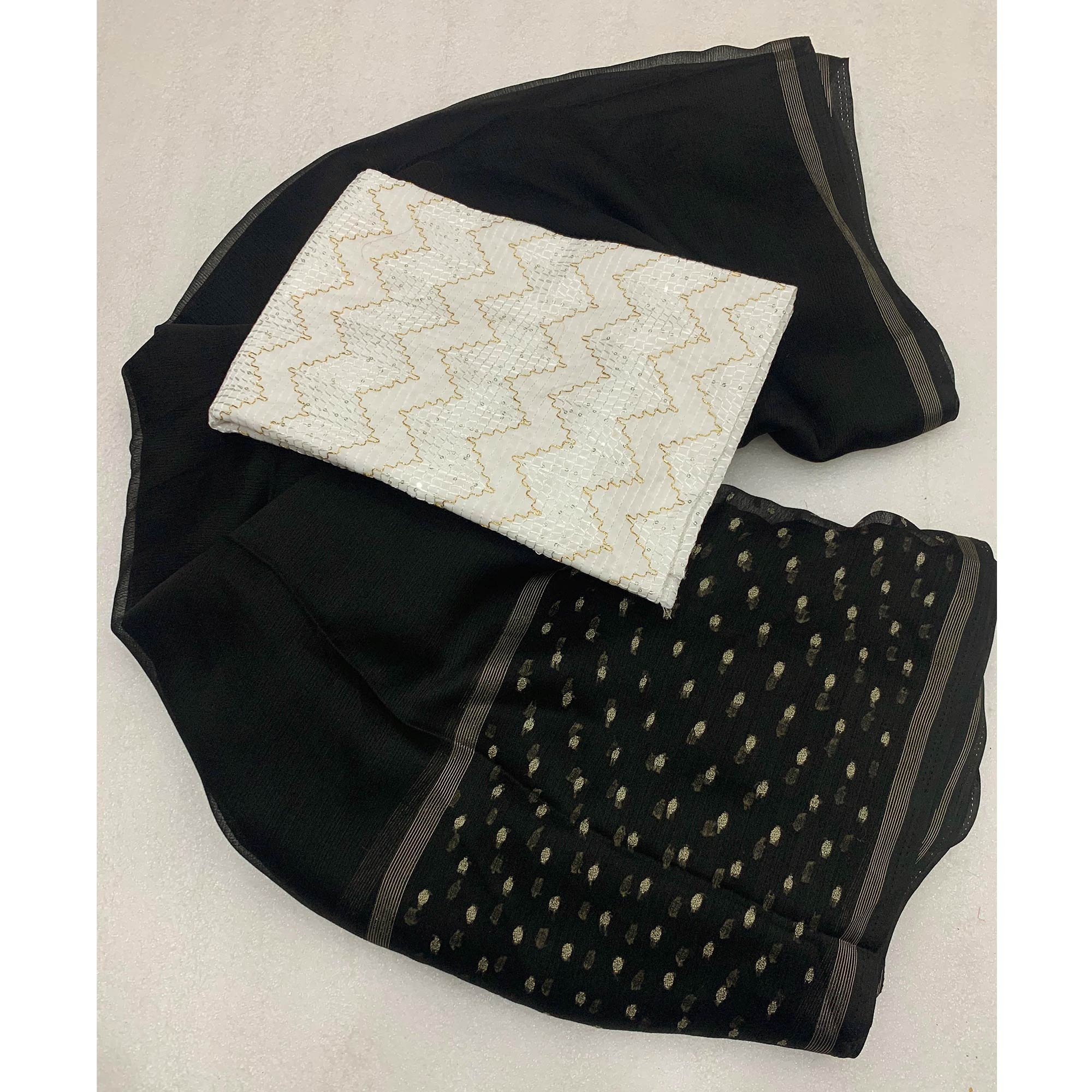 Black Woven Georgette Saree With Tassels