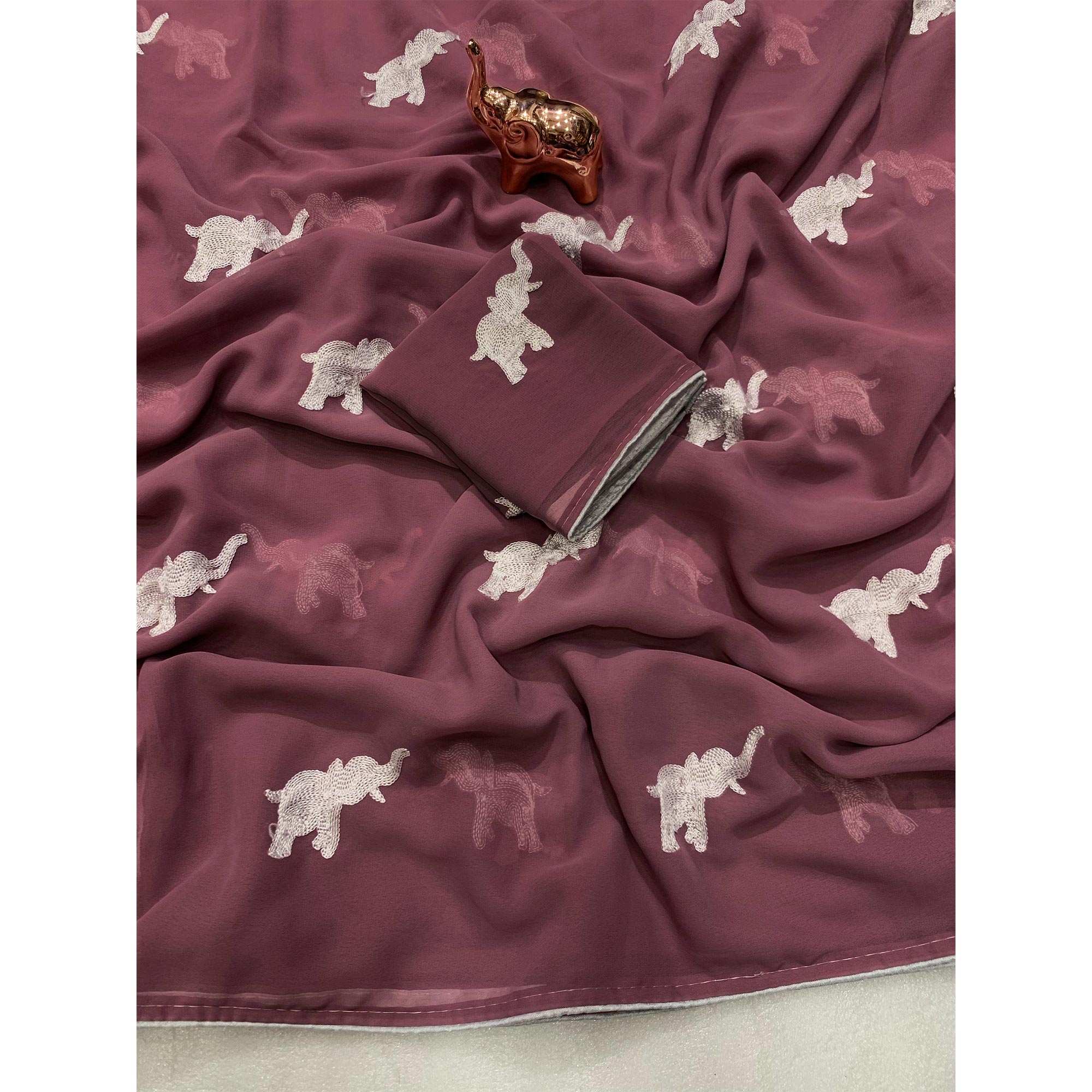 Mauve Georgette Saree Featuring Exquisite Elephant Embroidery