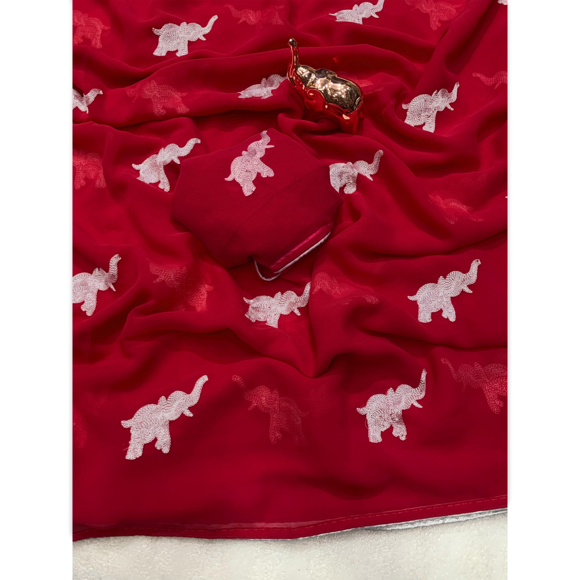 Pink Georgette Saree Featuring Exquisite Elephant Embroidery