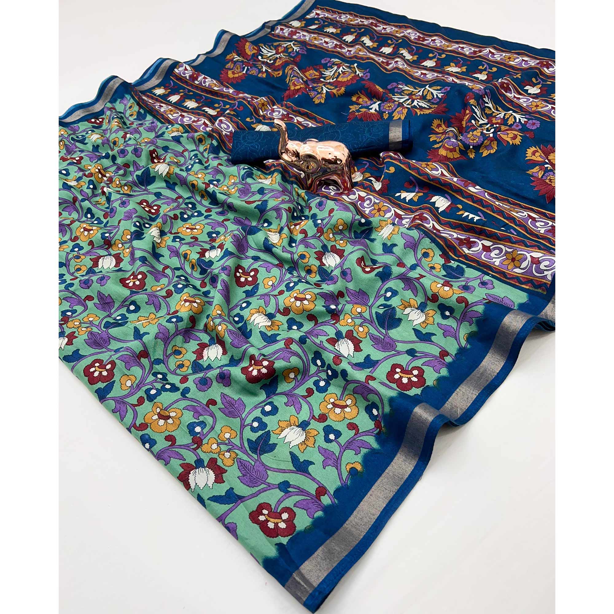 Sea Green Floral Printed Tussar Silk Blend Saree Enhanced With Intricate Zari Border Work