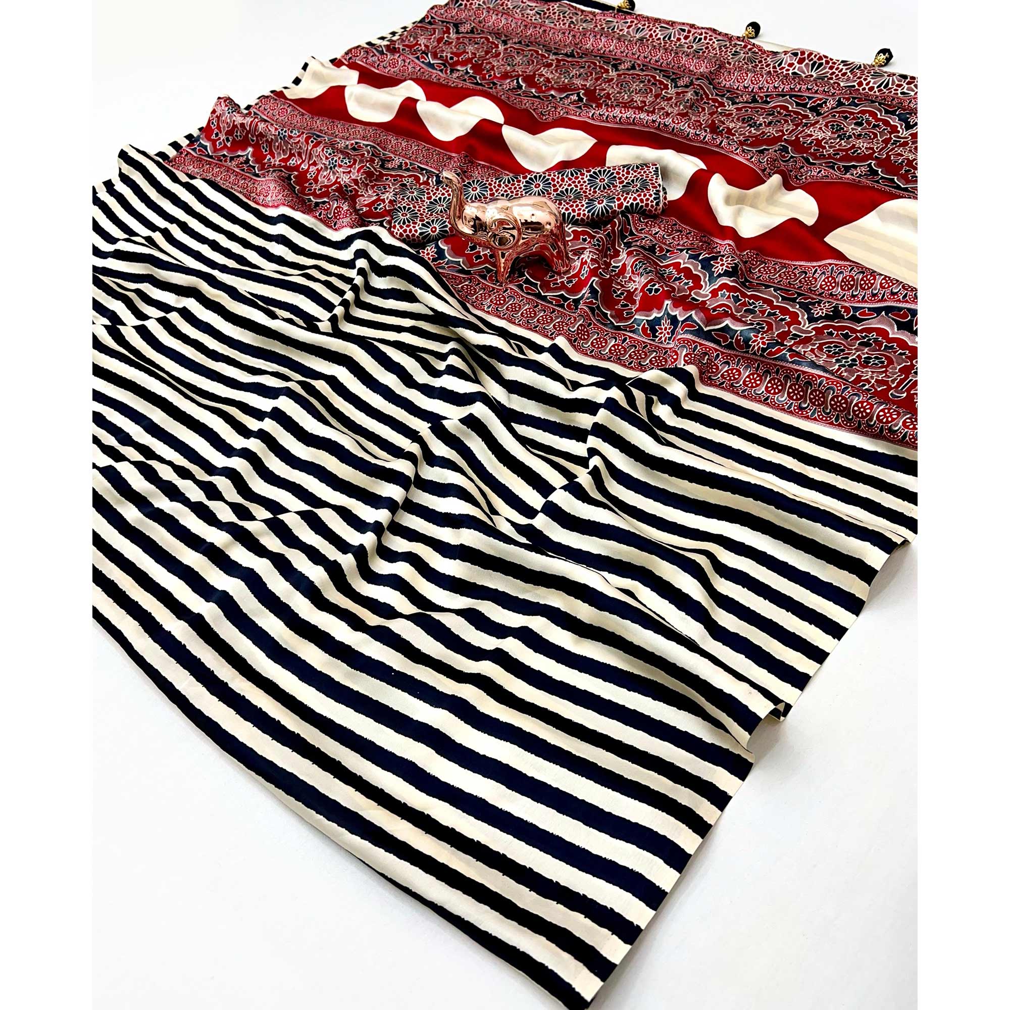 Luxe Partywear Saree in Black Satin with Modern Striped Print and Flowing Drape