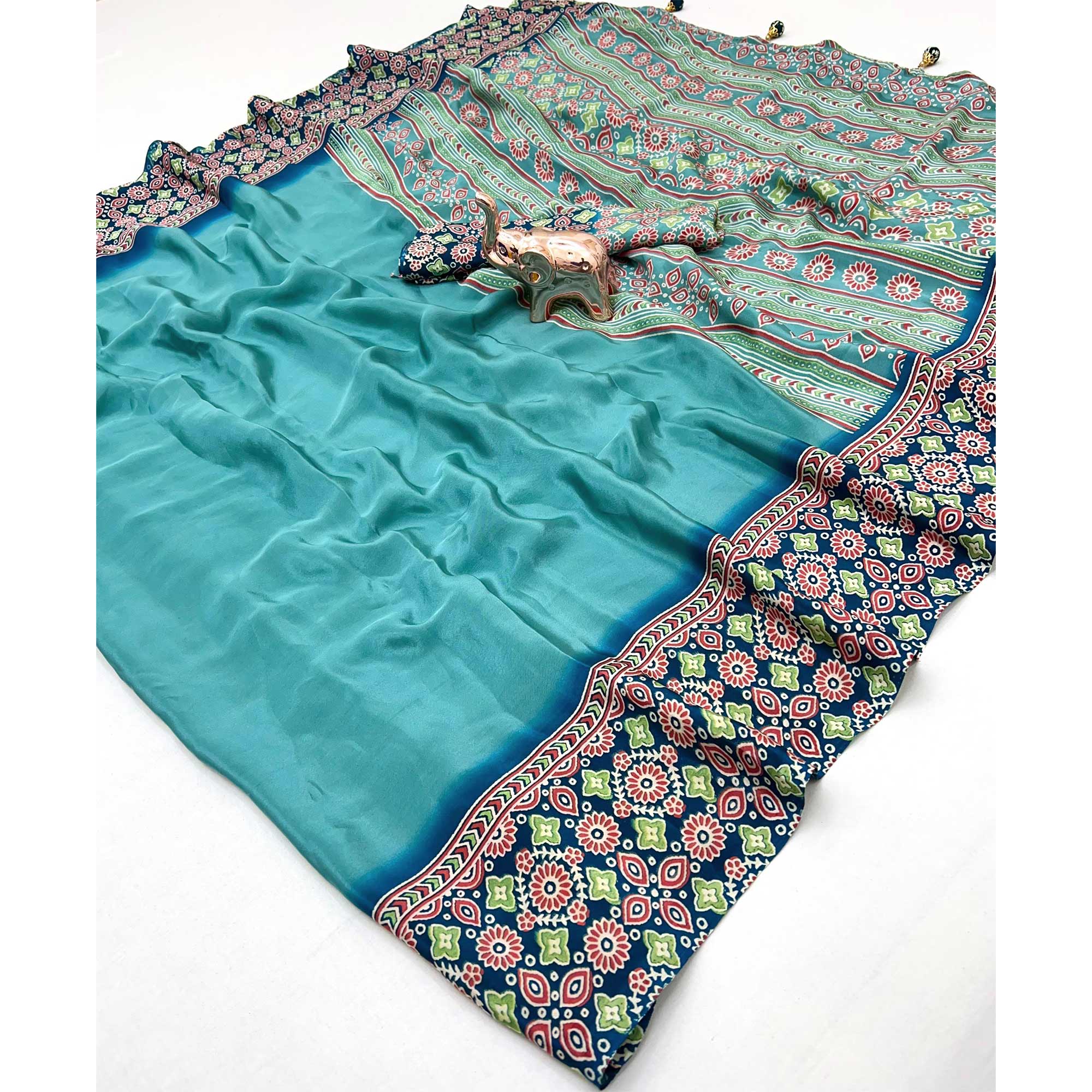 Turquoise Solid Satin Saree Featuring Bold Ajrakh Print and Tassel Accented Pallu