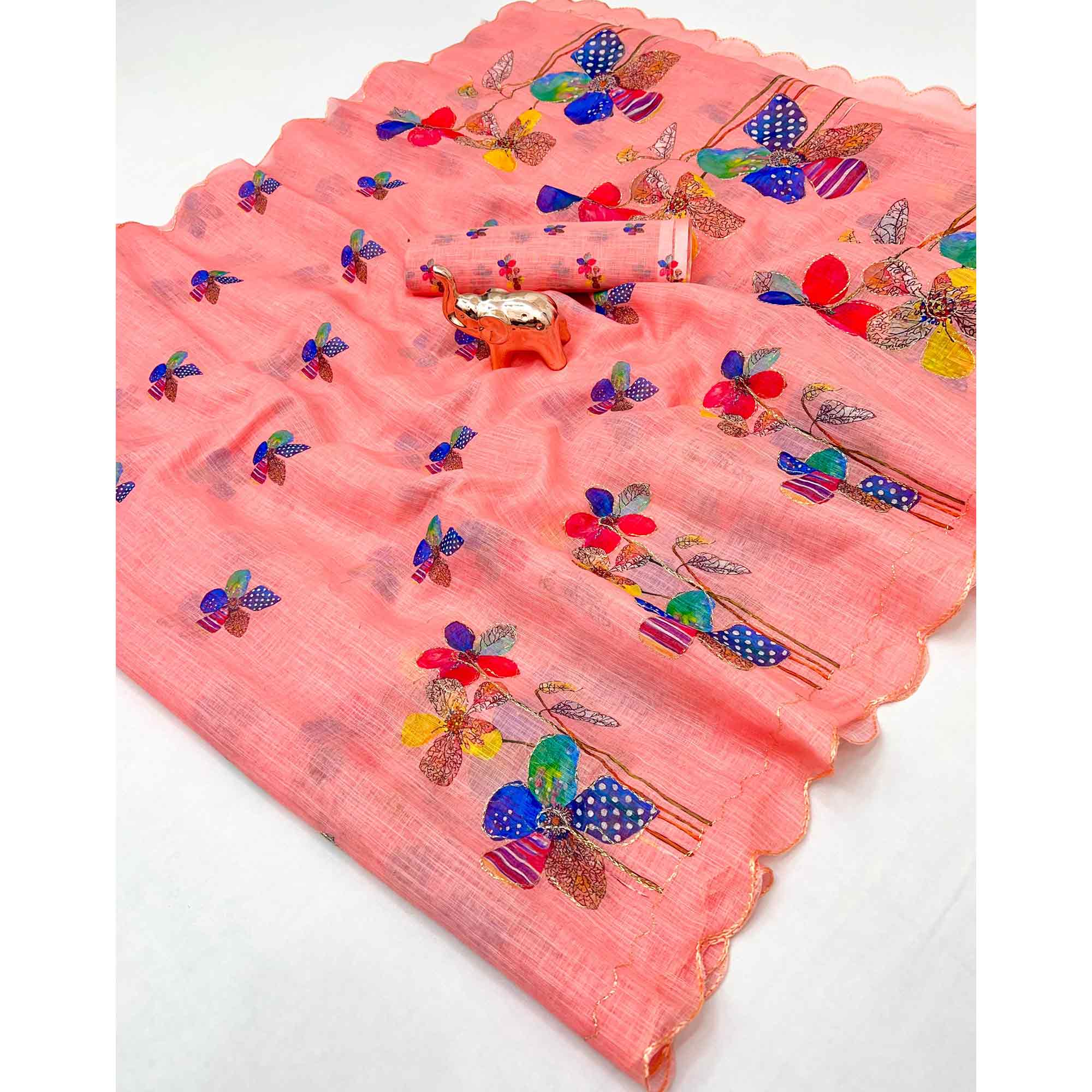 Coral Pink Linen Saree Featuring Floral Digital Print With Zari Outline & Cutwork Border
