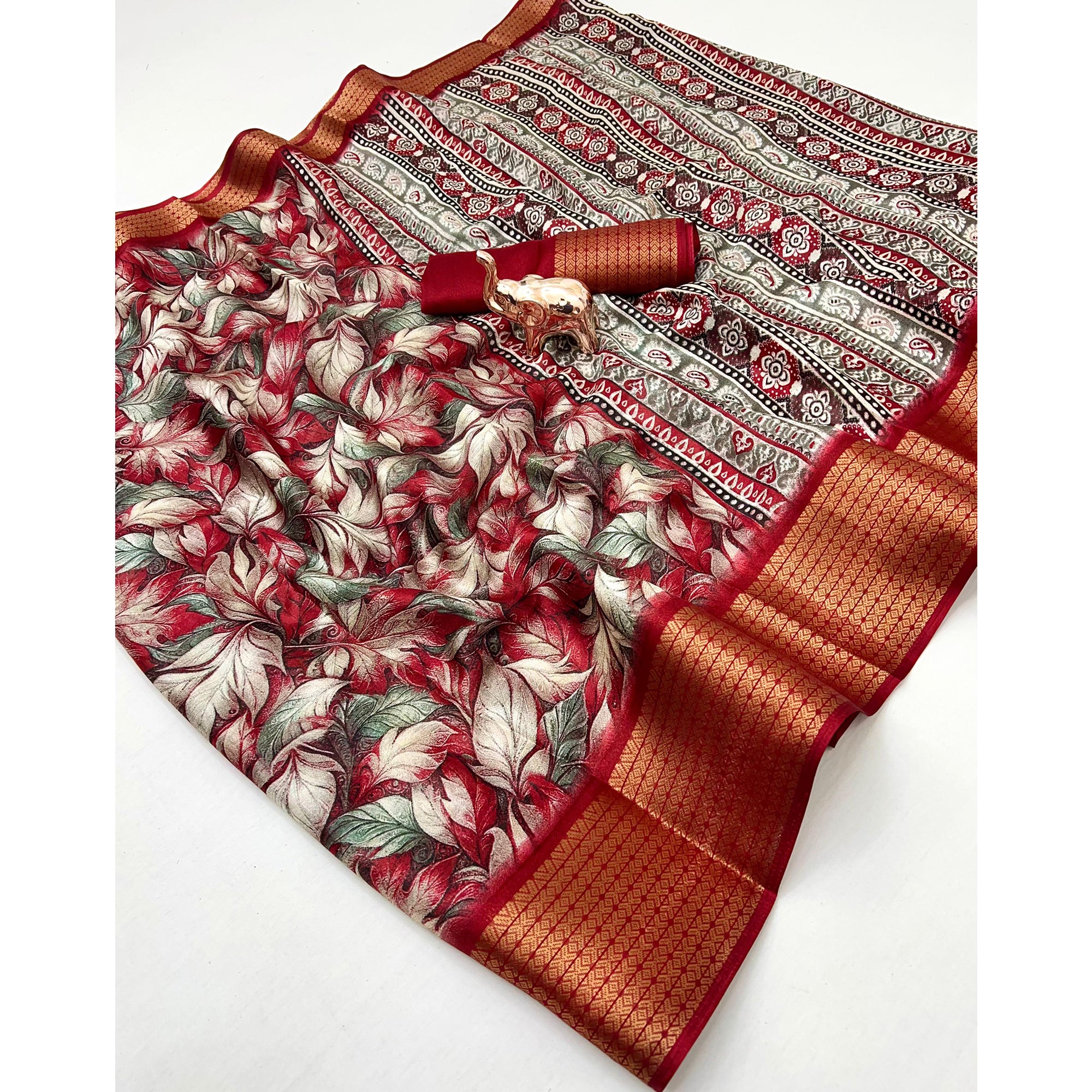 Cherry Red Leaf Printed Dola Silk Marshmallow Saree With Paisley Jaal Pallu & Lustrous Weaving Border