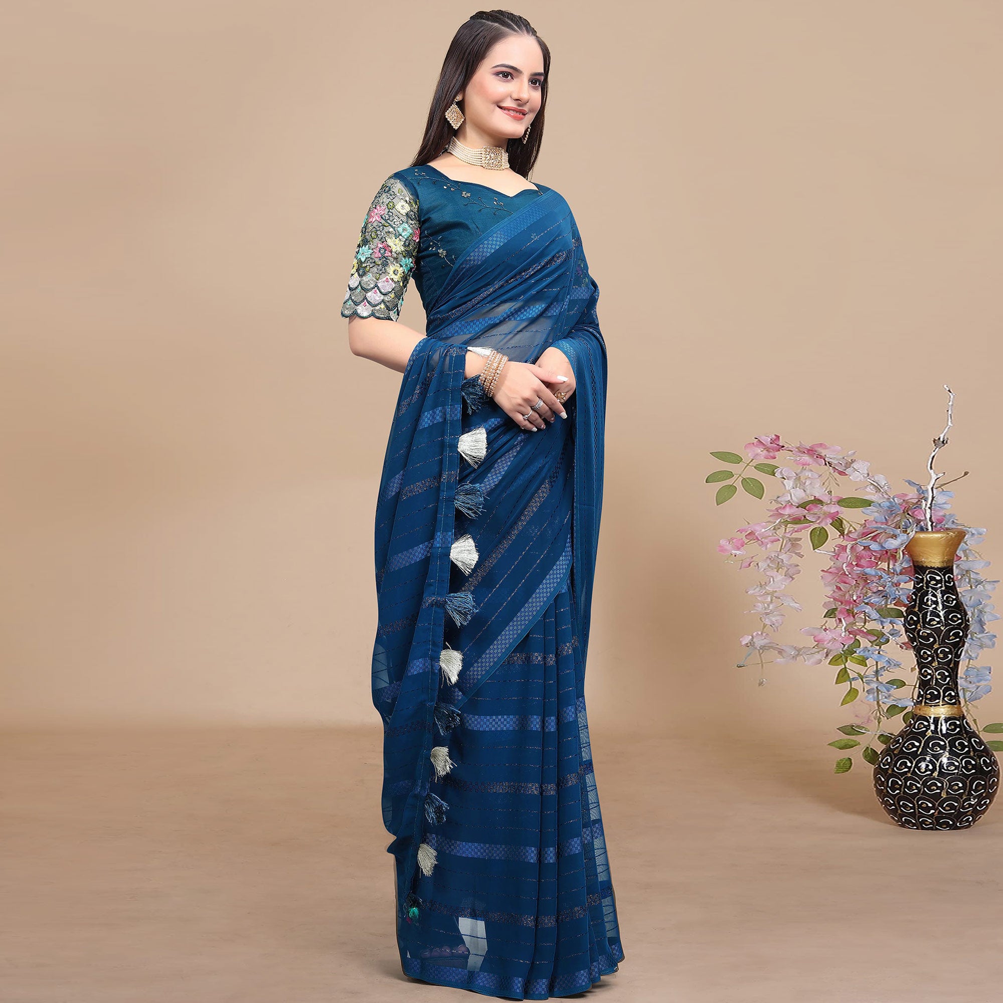 Teal Blue Woven Georgette Saree With Tassels