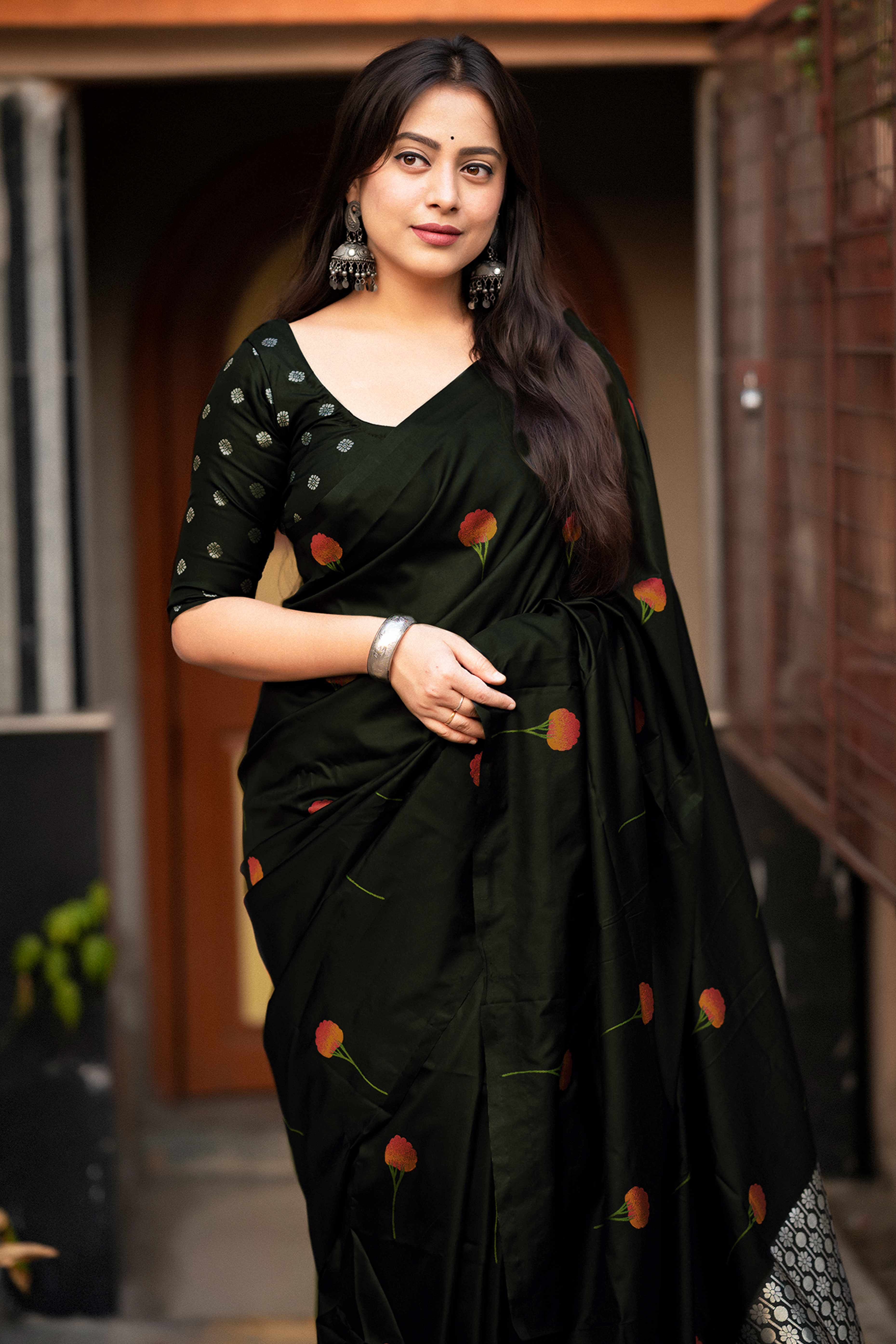 Graceful Black Banarasi Silk Saree With Floral Zari Weaving & Tassel Border