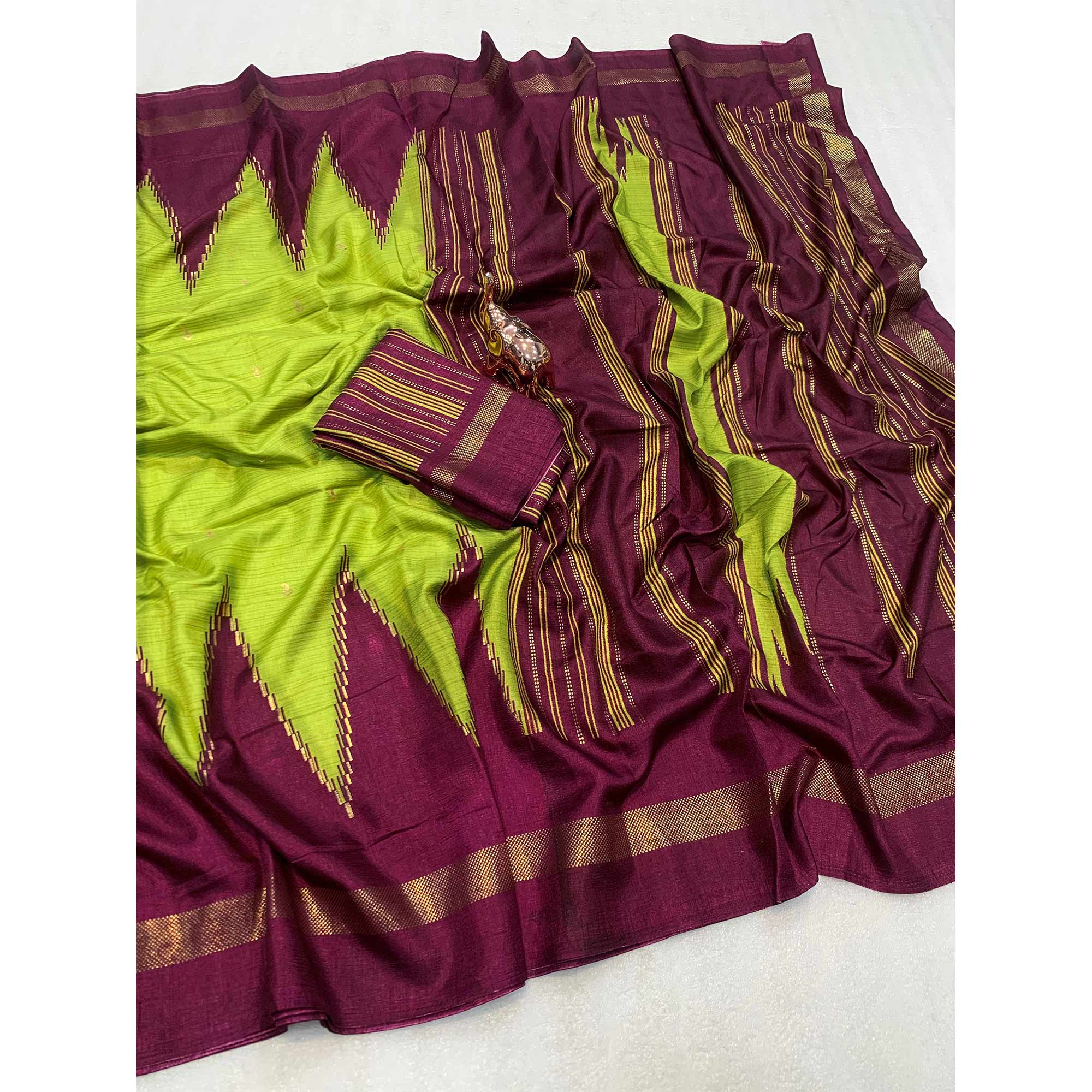Subtle and Stylish Green Saree with Ikkat Prints in Luxe Dola Silk for Festive Wear