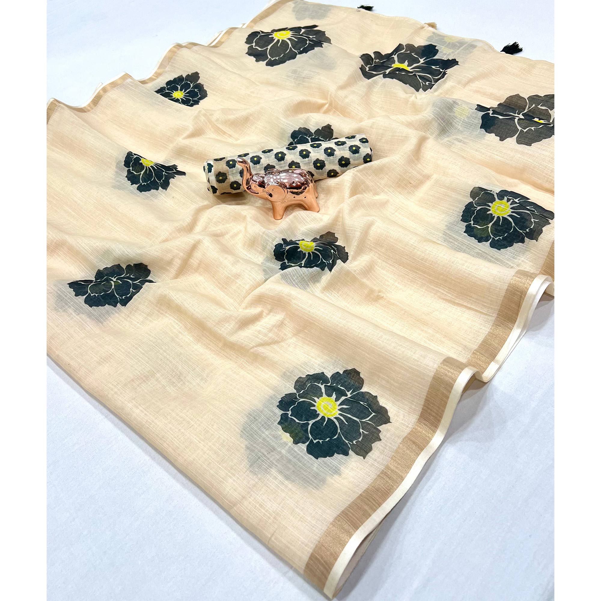 Graceful Cream Floral Printed Saree in Linen Silk with Delicate Tassel Accents