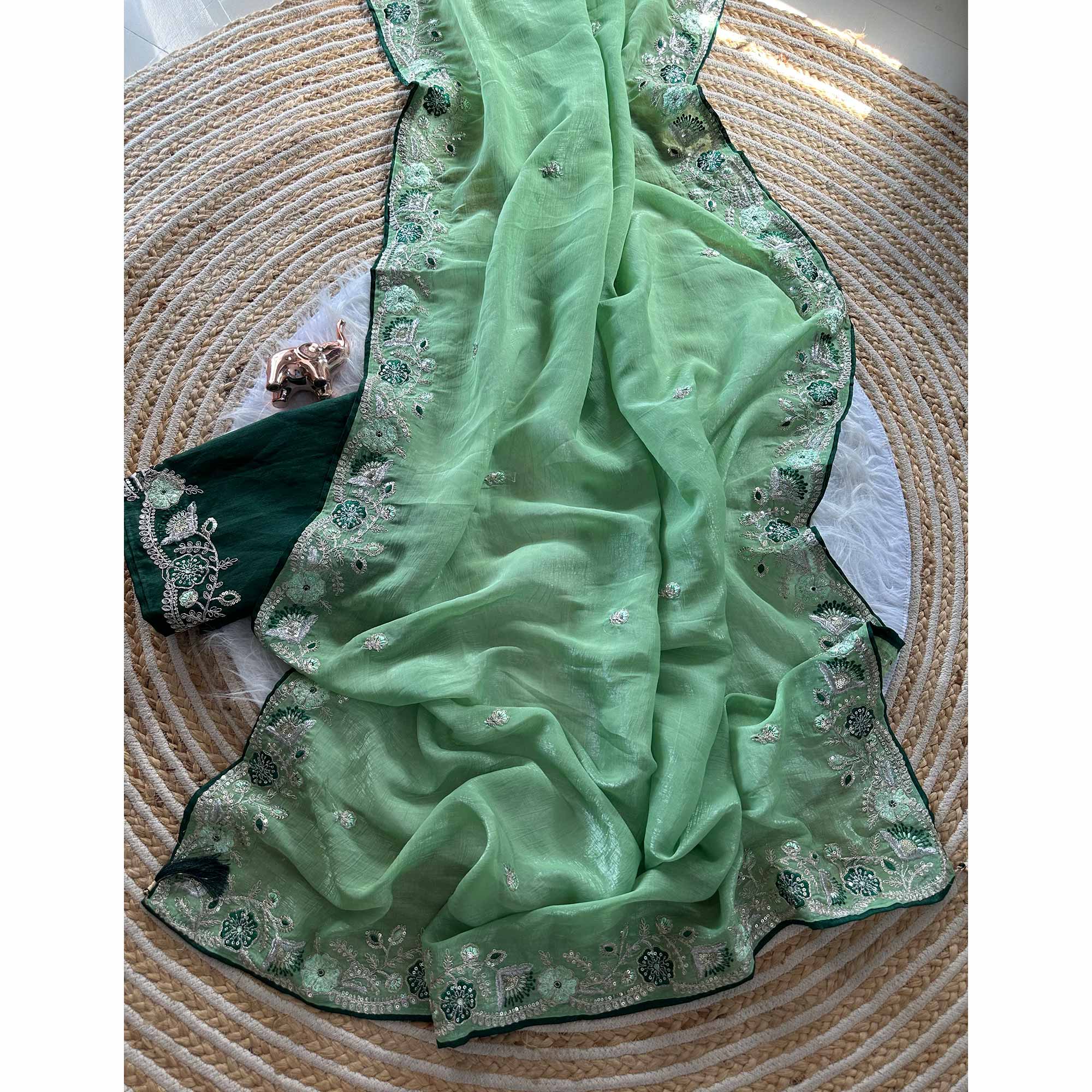 Green Pure Silk Saree Showcasing Floral Sequins Embroidery With A Decorative Tassel Pallu