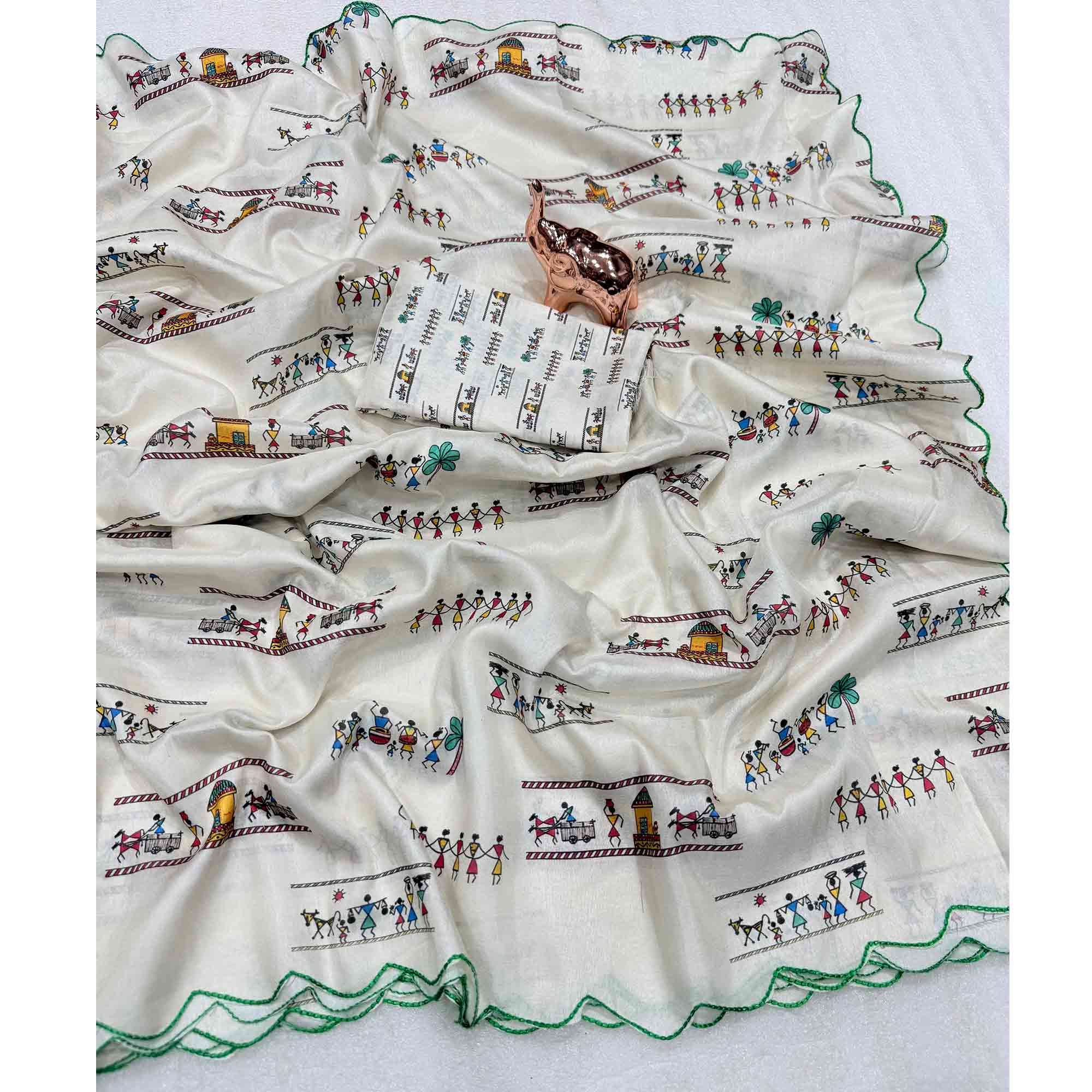 Graceful Off White Dola Silk Saree Highlighted with Handcrafted Warli Motifs