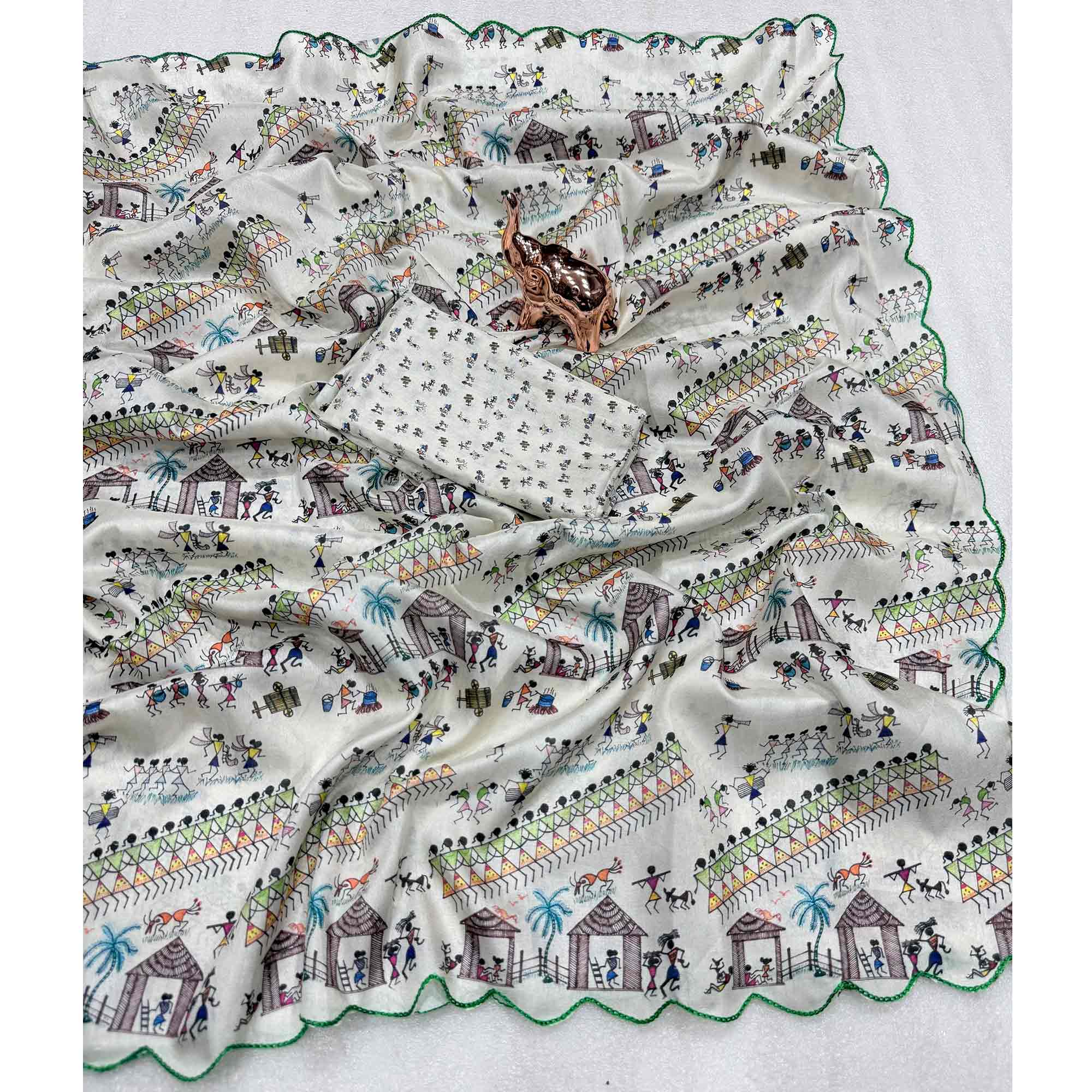 Sophisticated Off White Dola Silk Saree Adorned with Traditional Warli Patterns