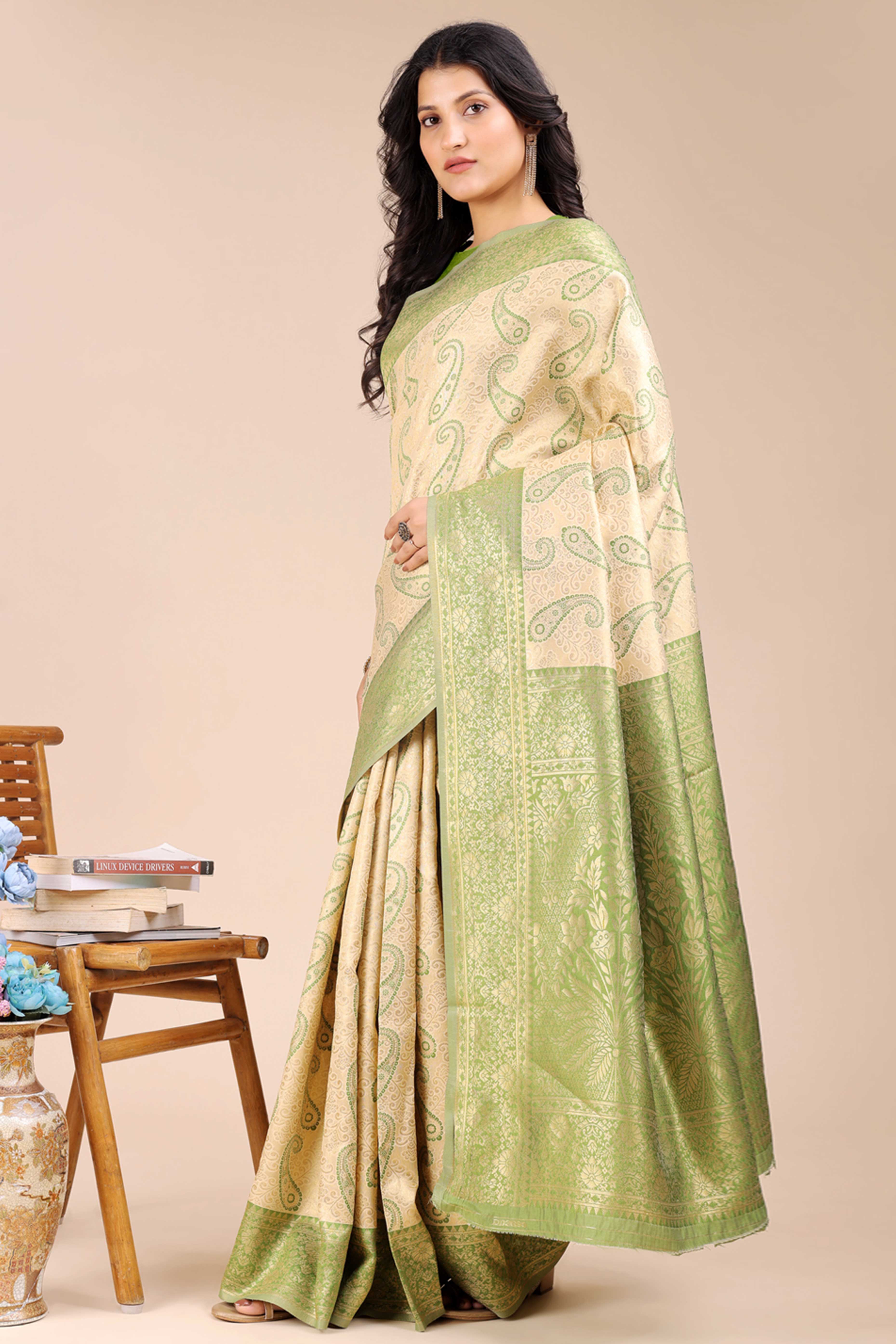 Cream Banarasi Silk Saree Featuring Light Green Floral Zari Weaving and a Rich Contrast Border