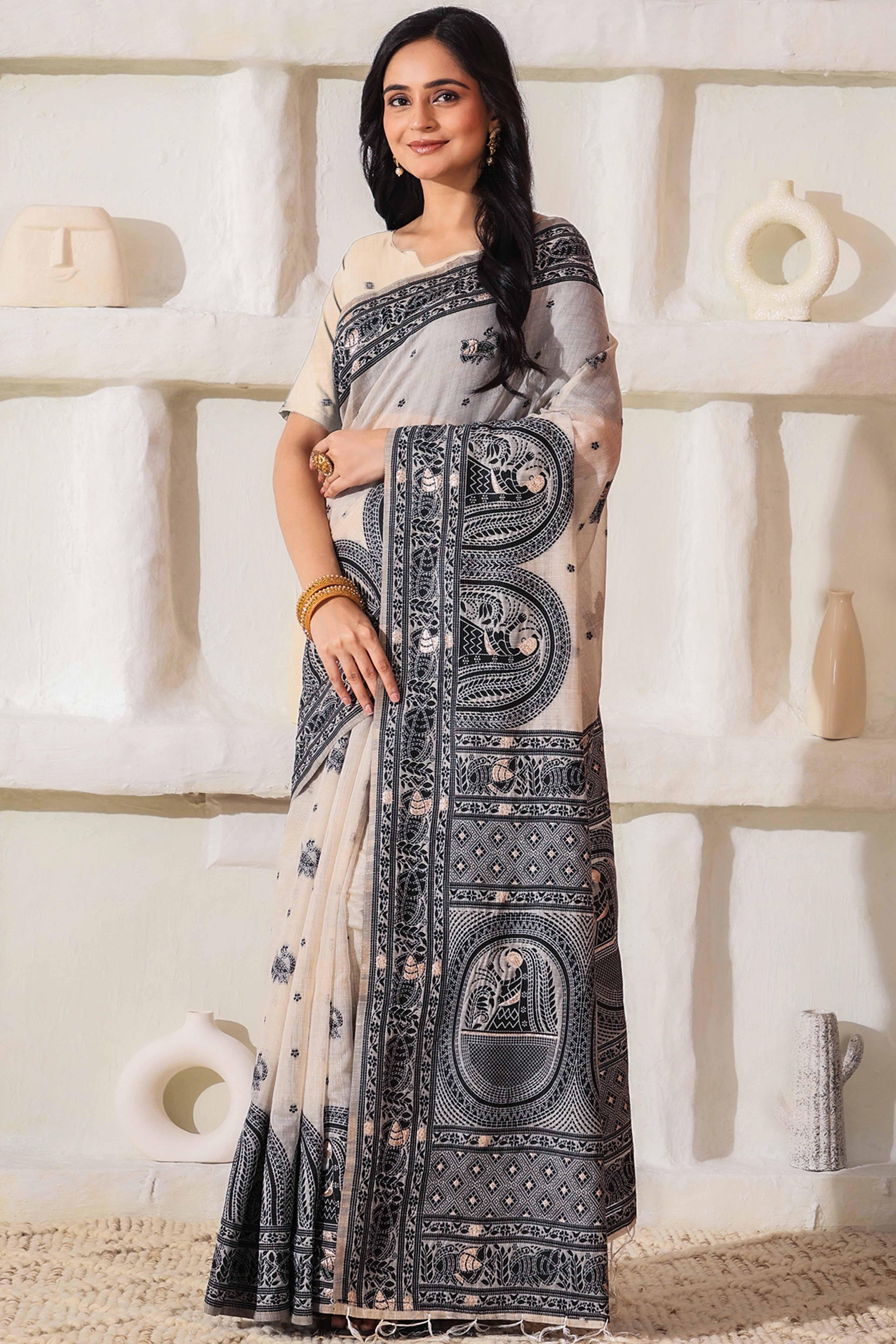 Weaving Cream & Black Linen Cotton Saree Adorned With Graceful Tassel Detailing