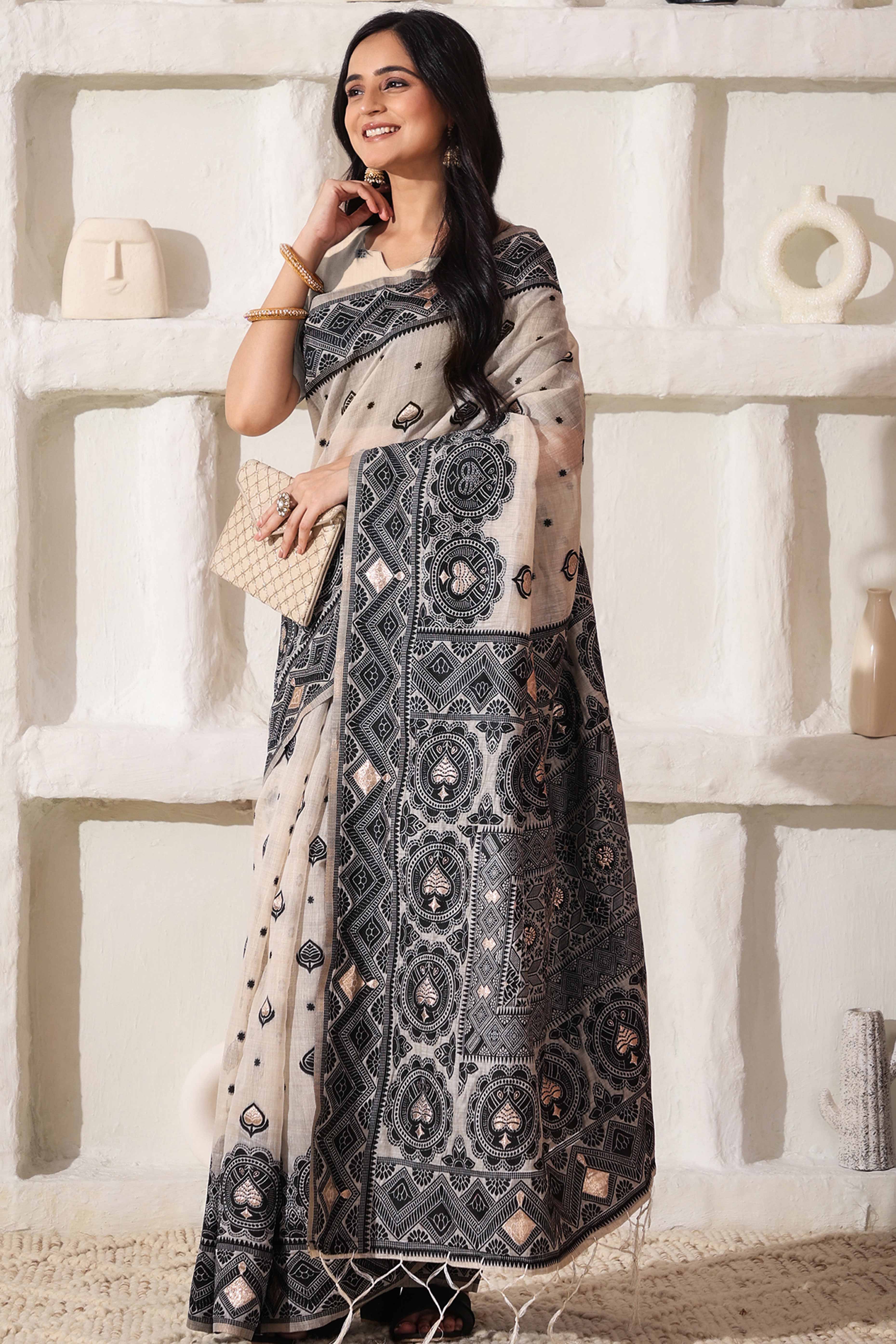 Timeless Cream & Black Saree In Linen Cotton With Rich Zari Weaving And Tassel Pallu